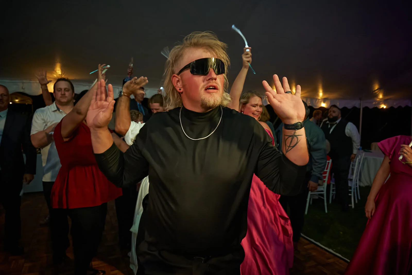 Guest dancing exuberantly at the reception