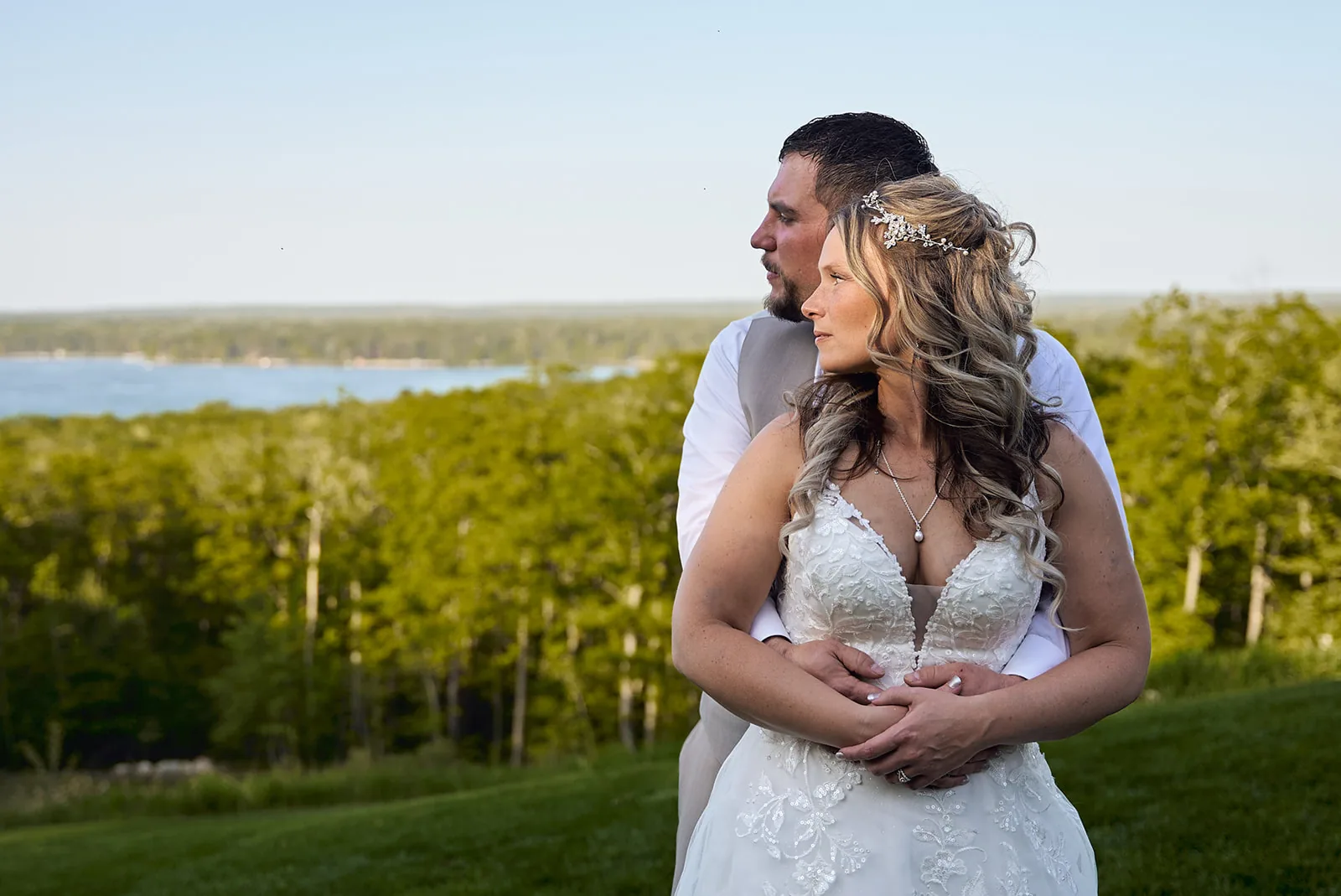 Bride and groom at the Manor at Fire Tower Hill, overlooking the lake