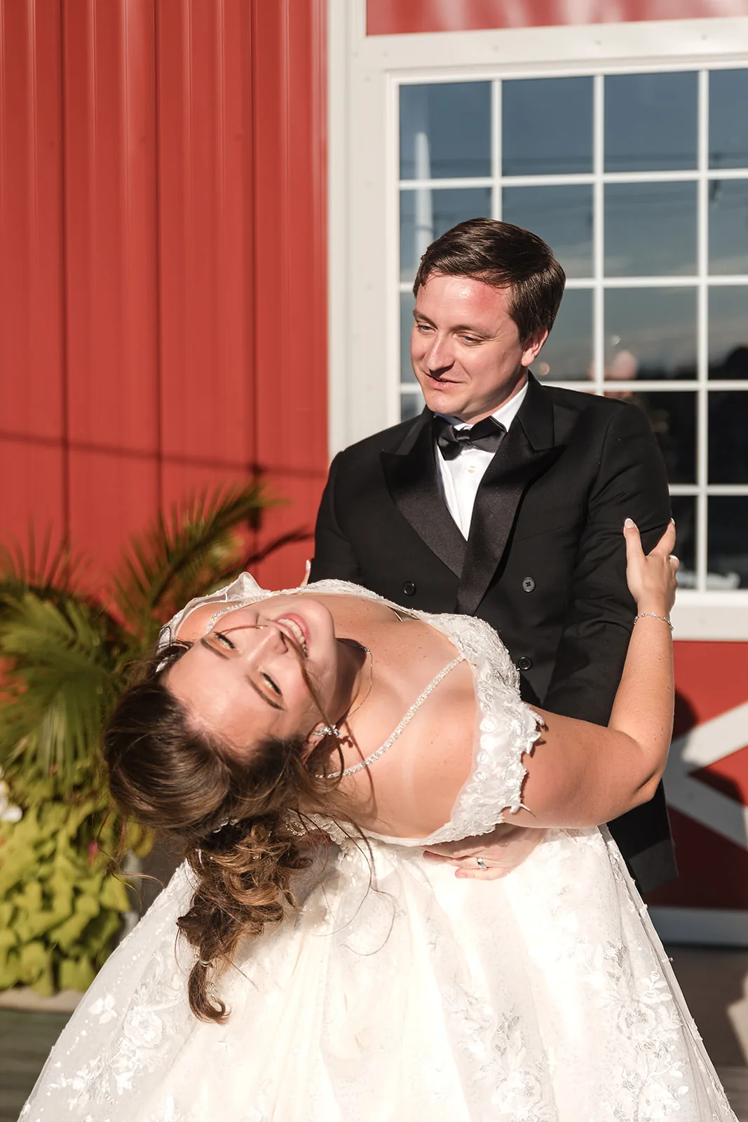 bride and groom cutting cake together at reception