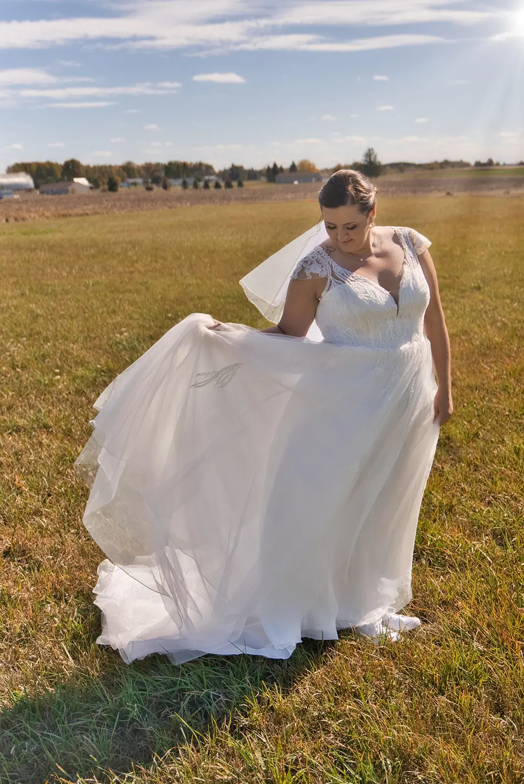 Bride flowing gown lifting dress autumn — Chelsea & Jake's wedding at Ogemaw County Fairgrounds, West Branch, MI