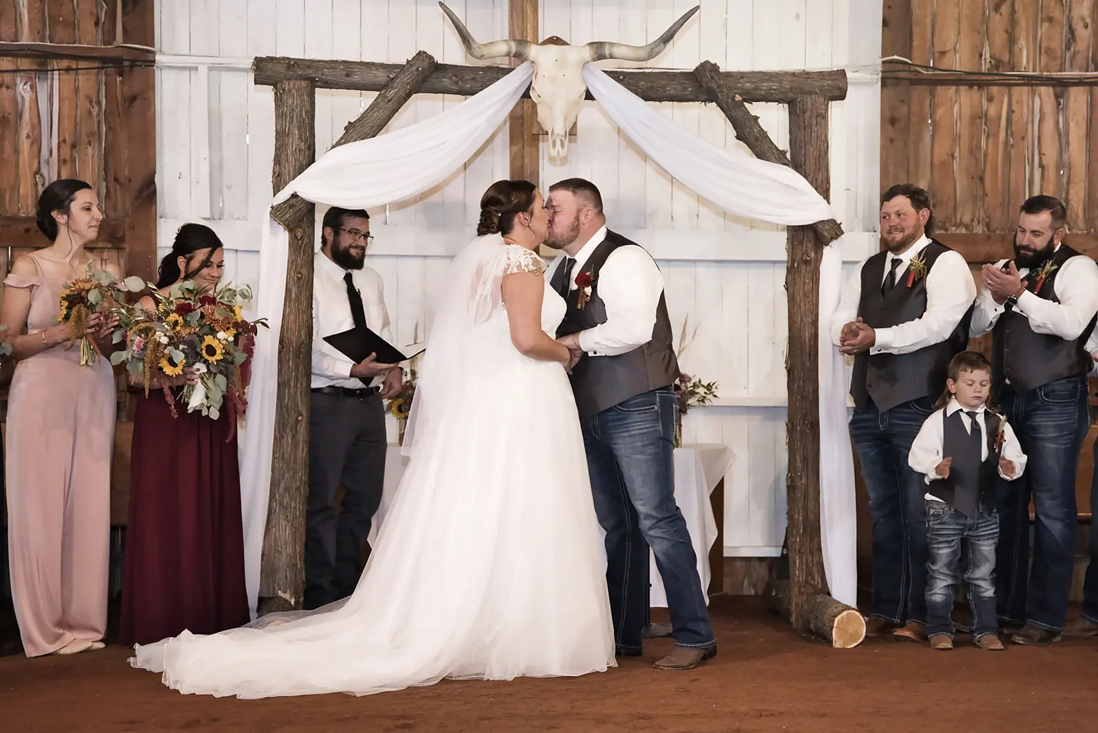 Bride groom kissing white drapes wedding — Chelsea & Jake's wedding at Ogemaw County Fairgrounds, West Branch, MI