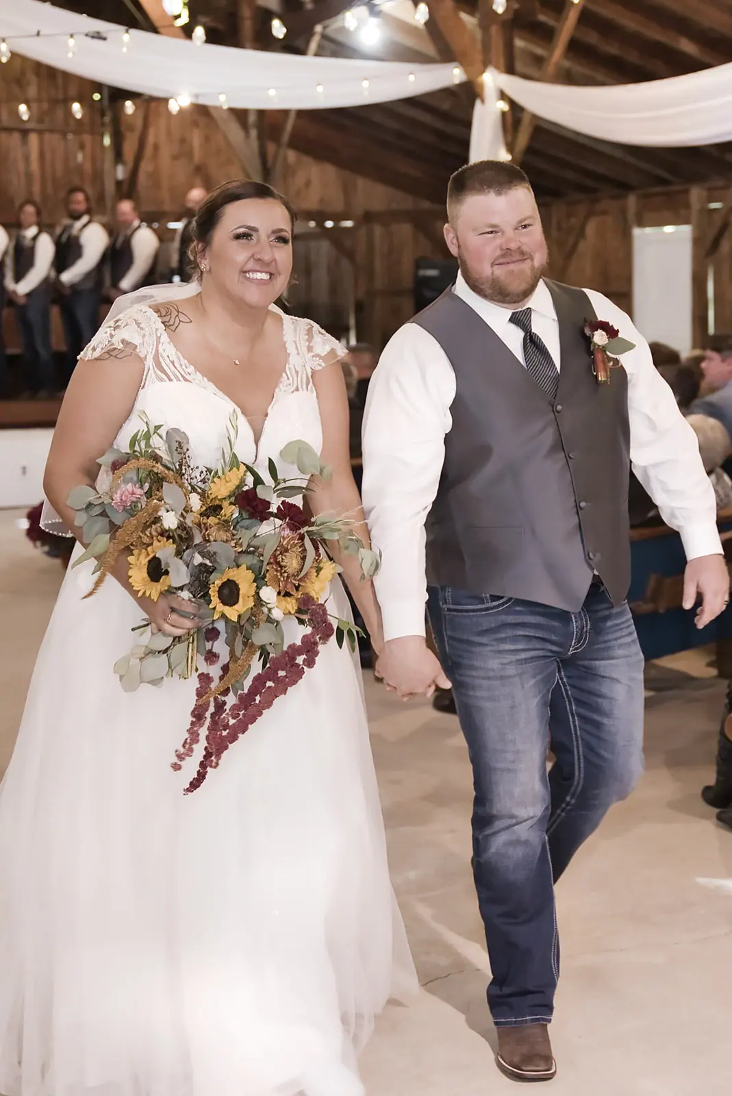 Bride groom walking aisle smiling bouquet — Chelsea & Jake's wedding at Ogemaw County Fairgrounds, West Branch, MI