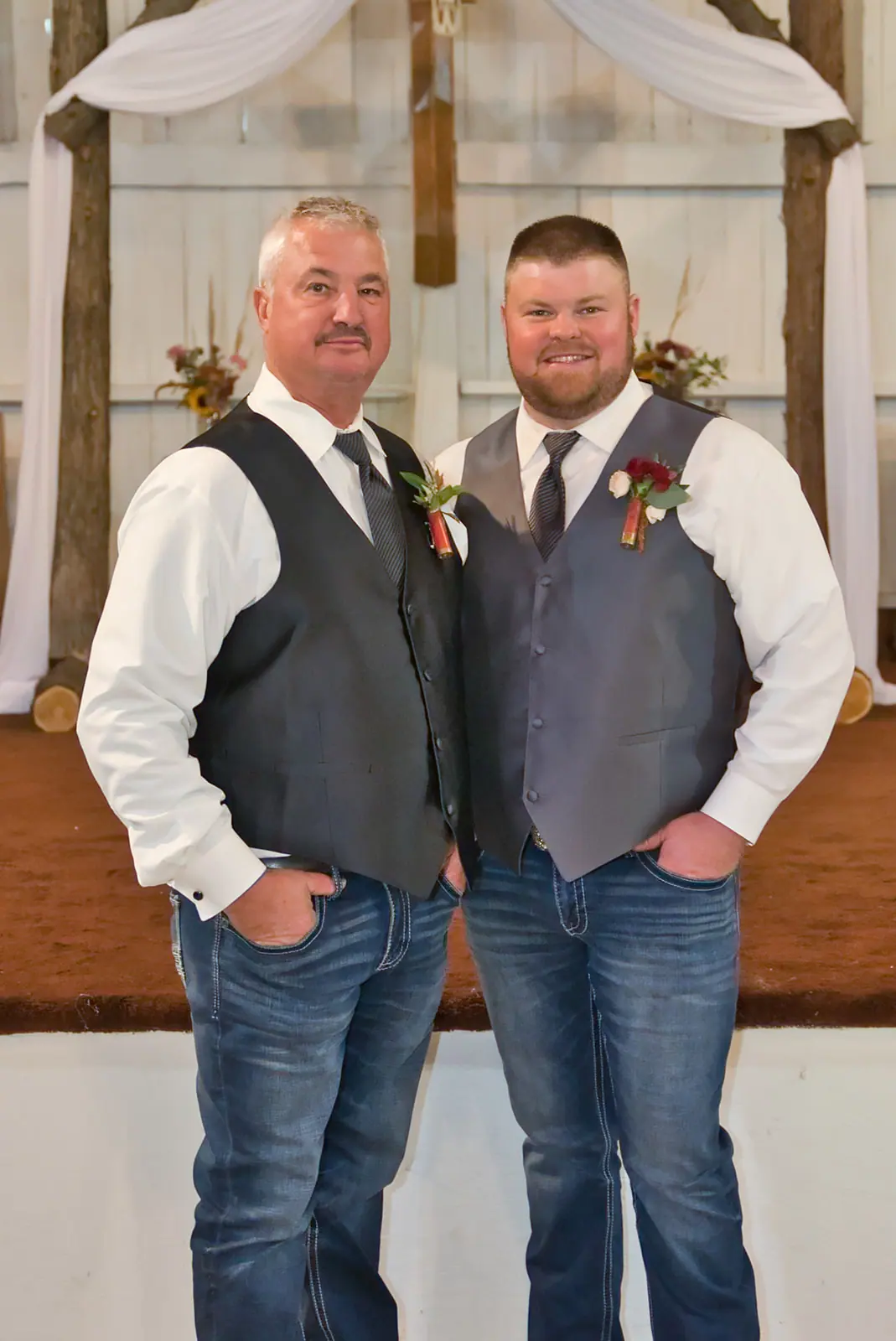 Two groomsmen grey vests jeans standing — Chelsea & Jake's wedding at Ogemaw County Fairgrounds, West Branch, MI