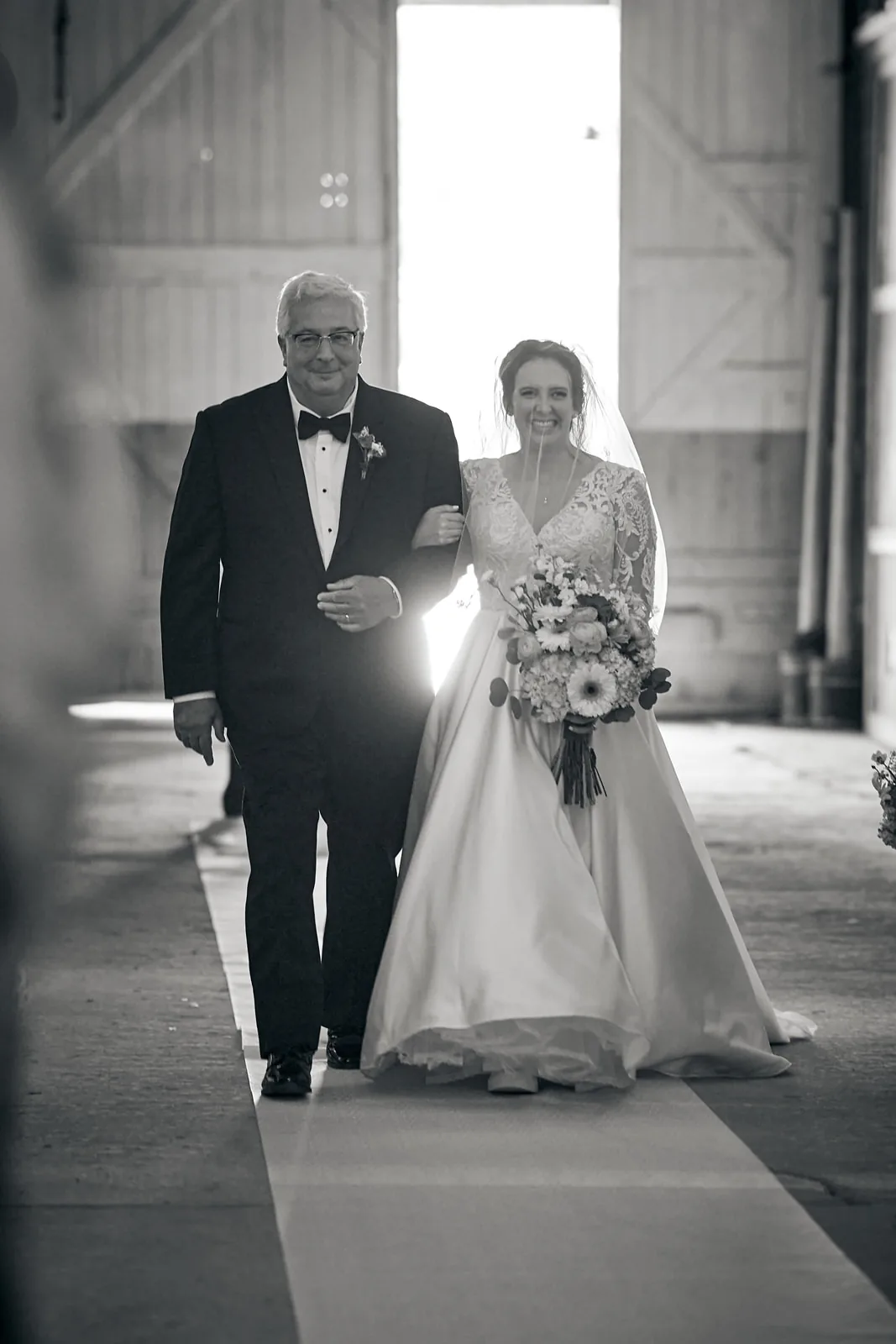 bw bride and groom first dance, string lights ceiling