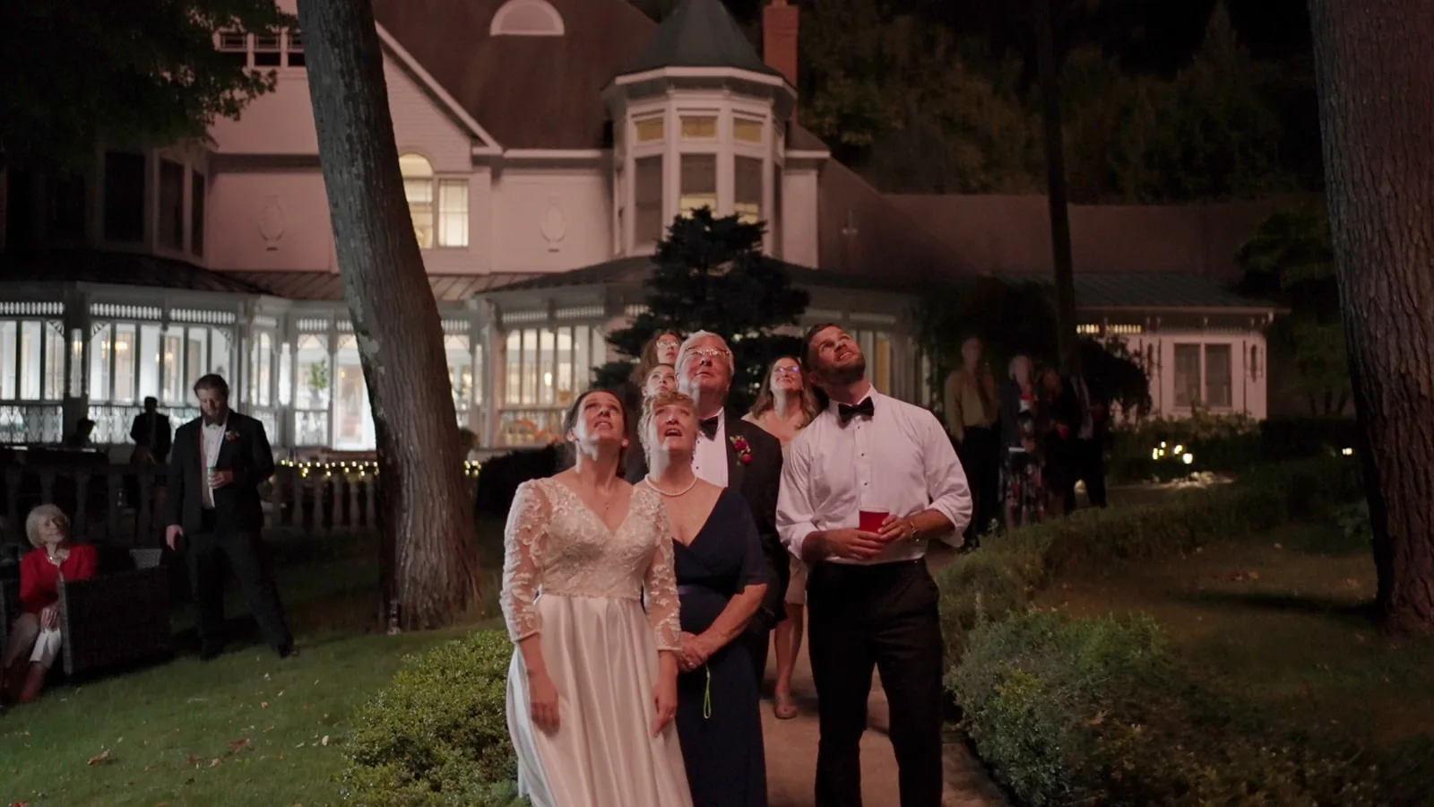 bridal party group tossing powder/confetti celebration shot