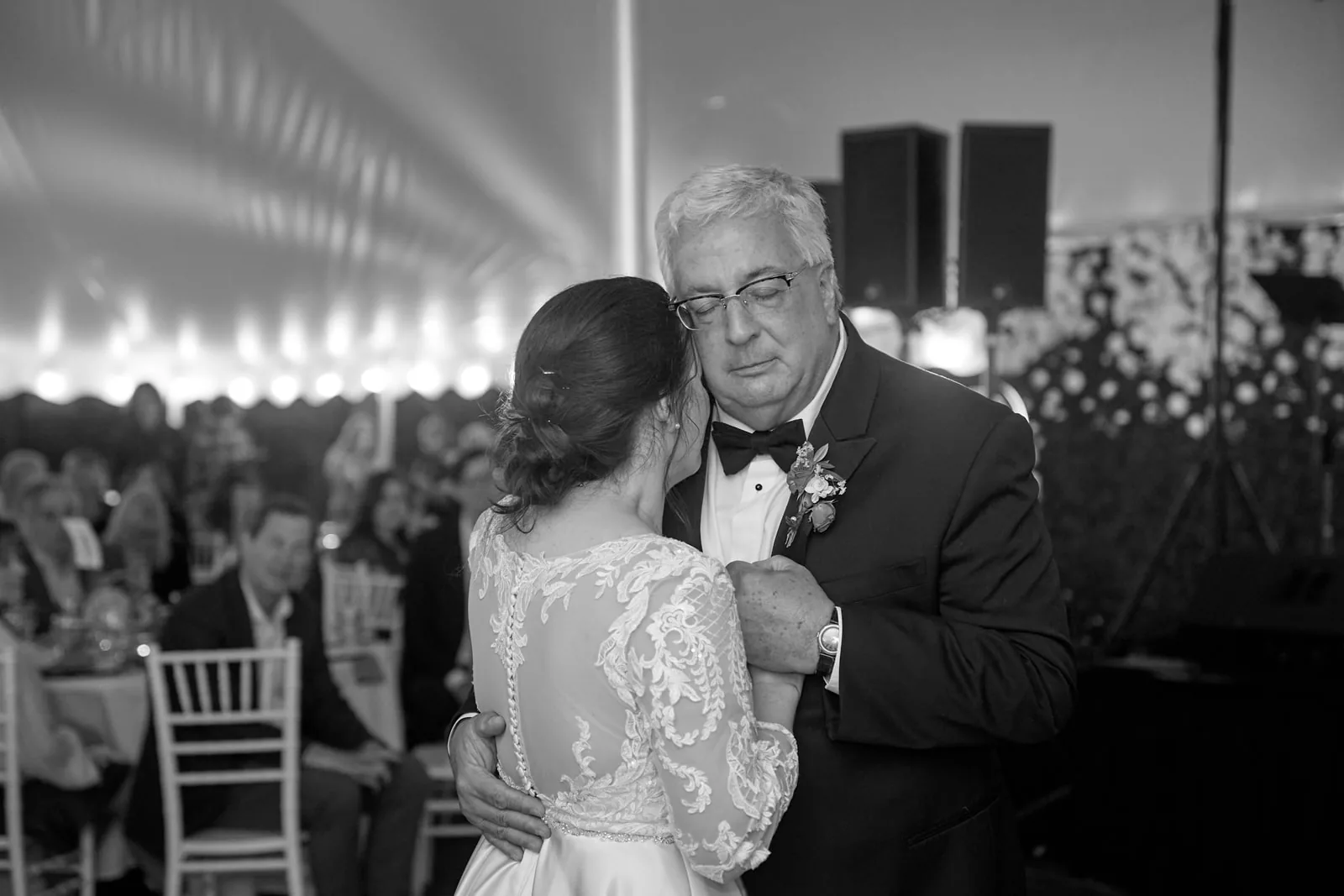 bw wide shot father-daughter dance at reception, string lights