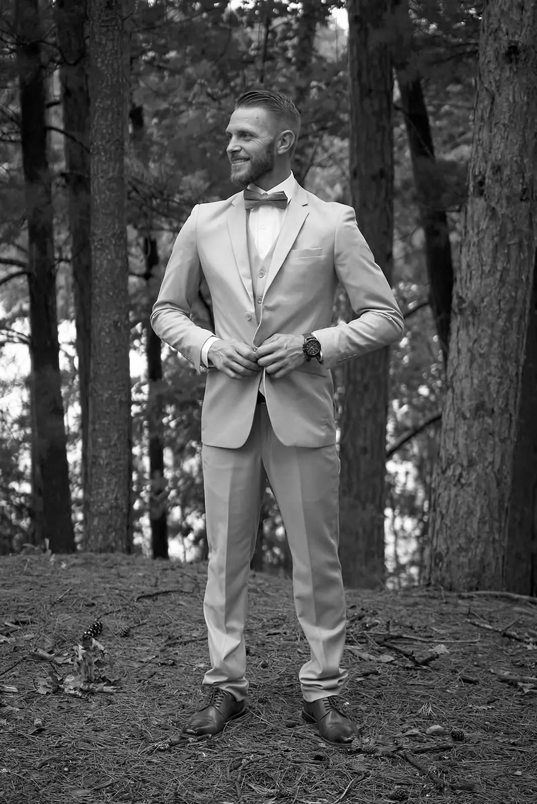 Black white groom tan suit bow — Erika & Corey's wedding at Sojourn Lakeside Resort, Gaylord, MI