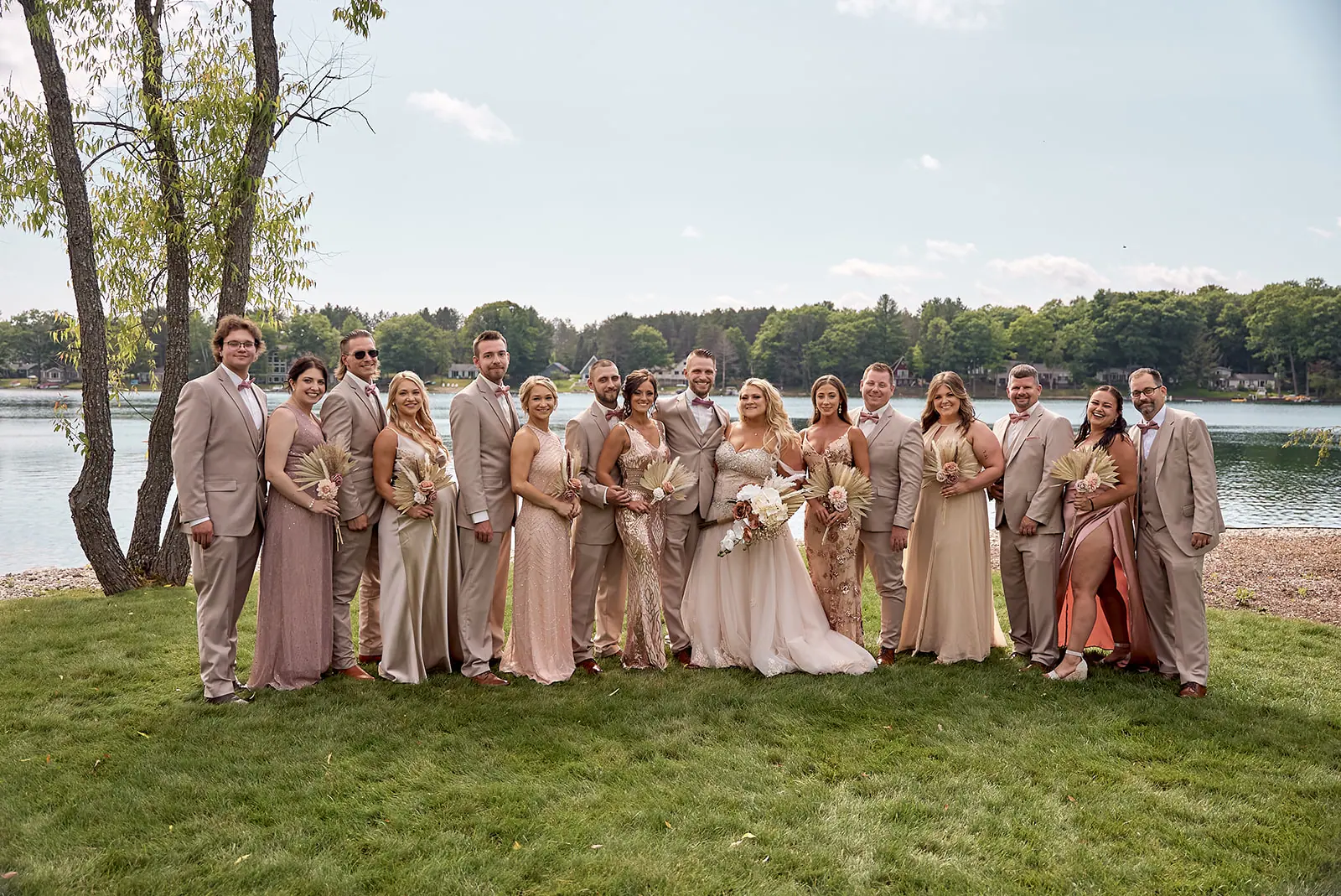 Bridal party tan blush lawn lake — Erika & Corey's wedding at Sojourn Lakeside Resort, Gaylord, MI