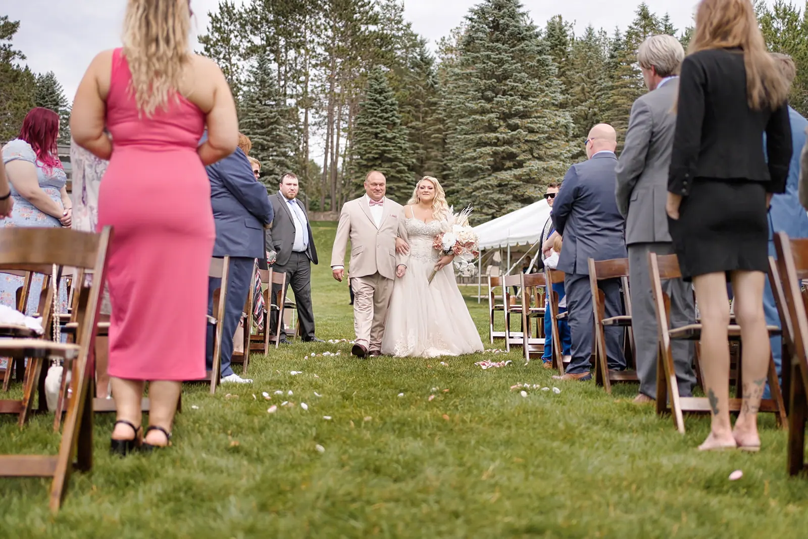 Bride walking aisle guests stand watch — Erika & Corey's wedding at Sojourn Lakeside Resort, Gaylord, MI
