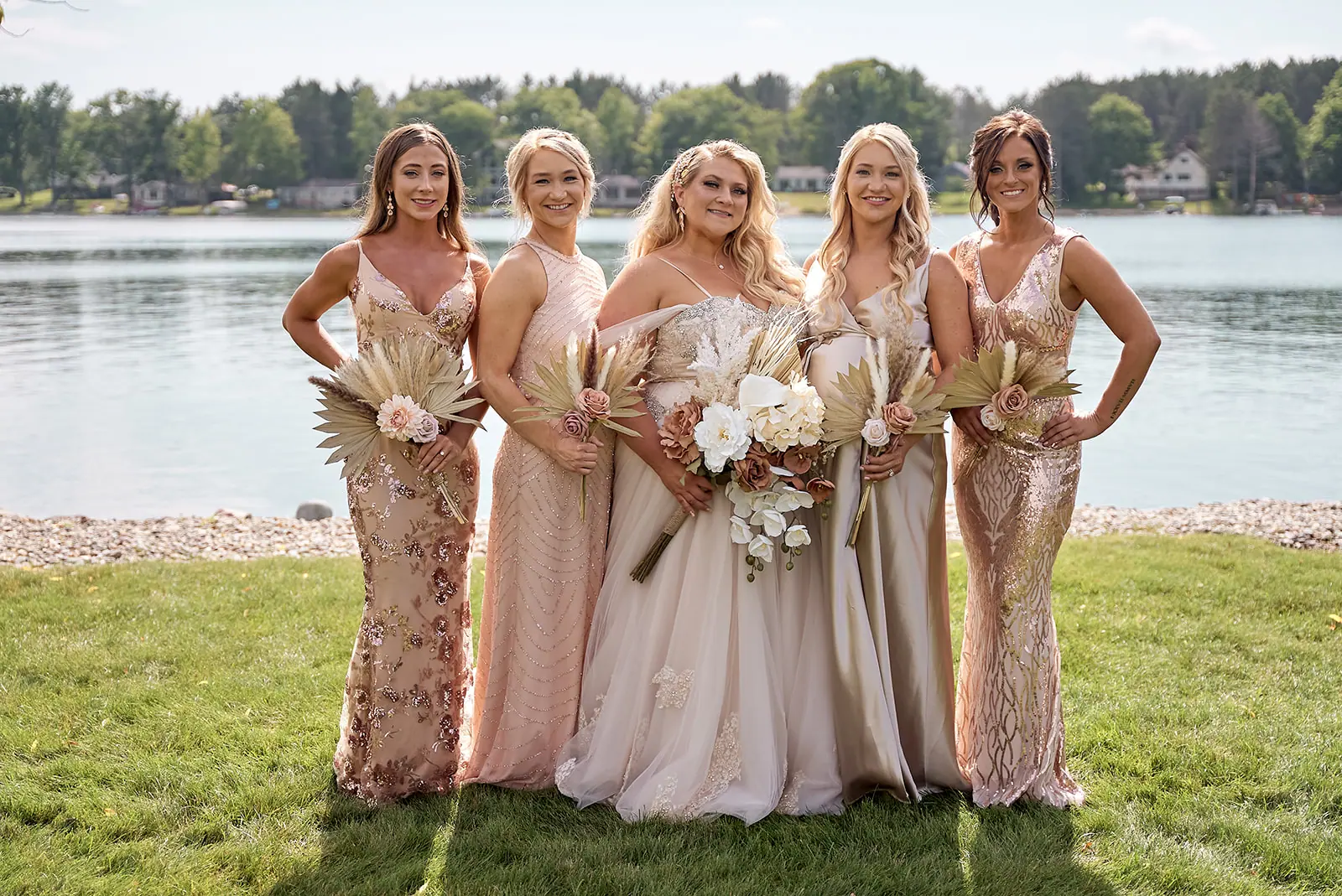 Bridesmaids champagne gowns bride center lake — Erika & Corey's wedding at Sojourn Lakeside Resort, Gaylord, MI