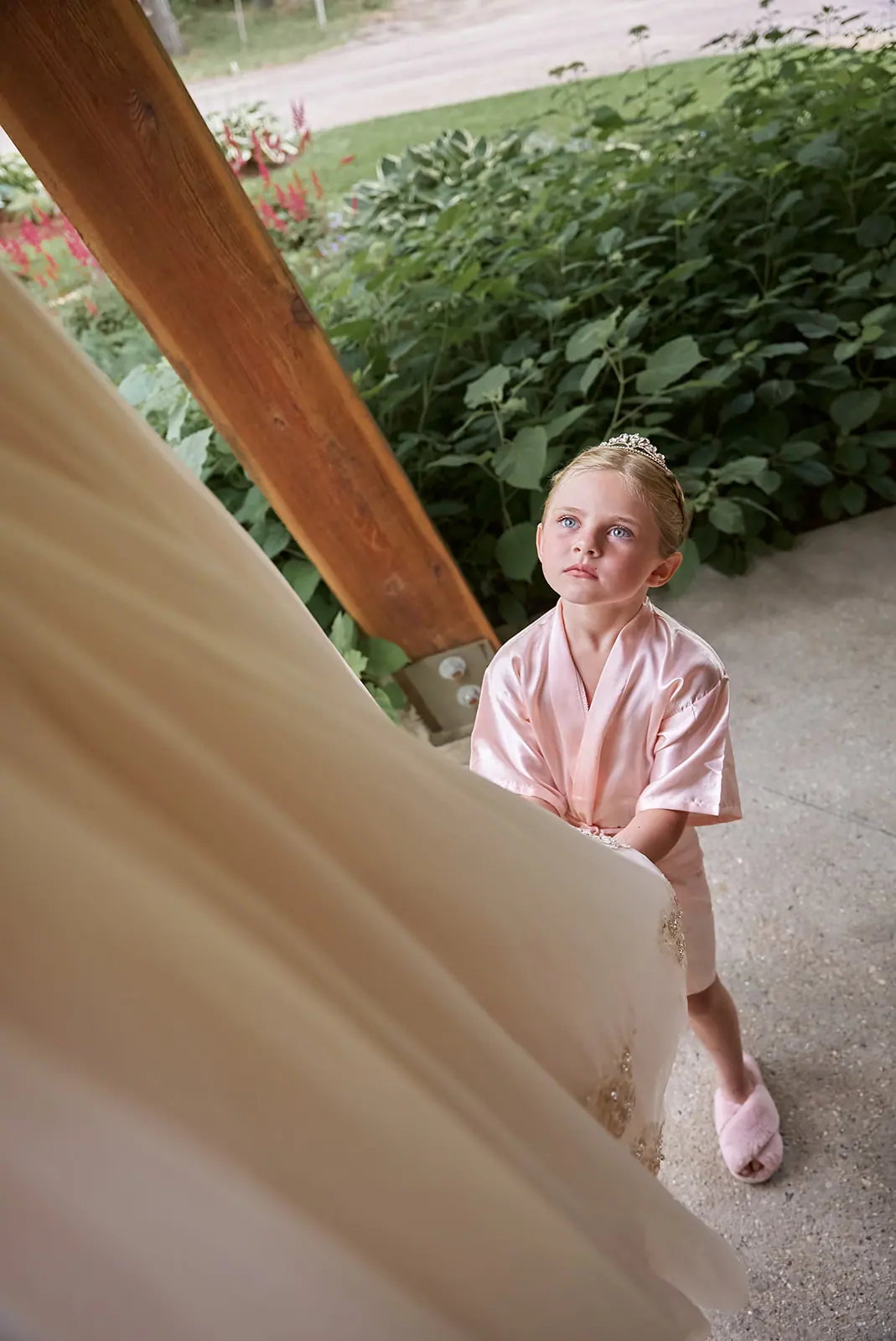 Young girl robe peeking gown — Erika & Corey's wedding at Sojourn Lakeside Resort, Gaylord, MI