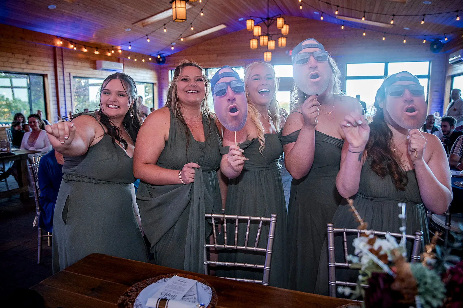 reception candid, bridal party playful group photo indoors