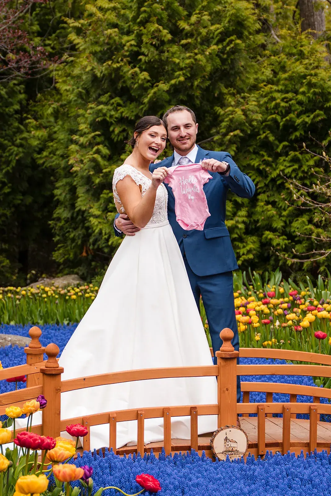 Bride and groom garden bridge candid — Jennifer & Parker's wedding at the Grand Hotel, Mackinac Island