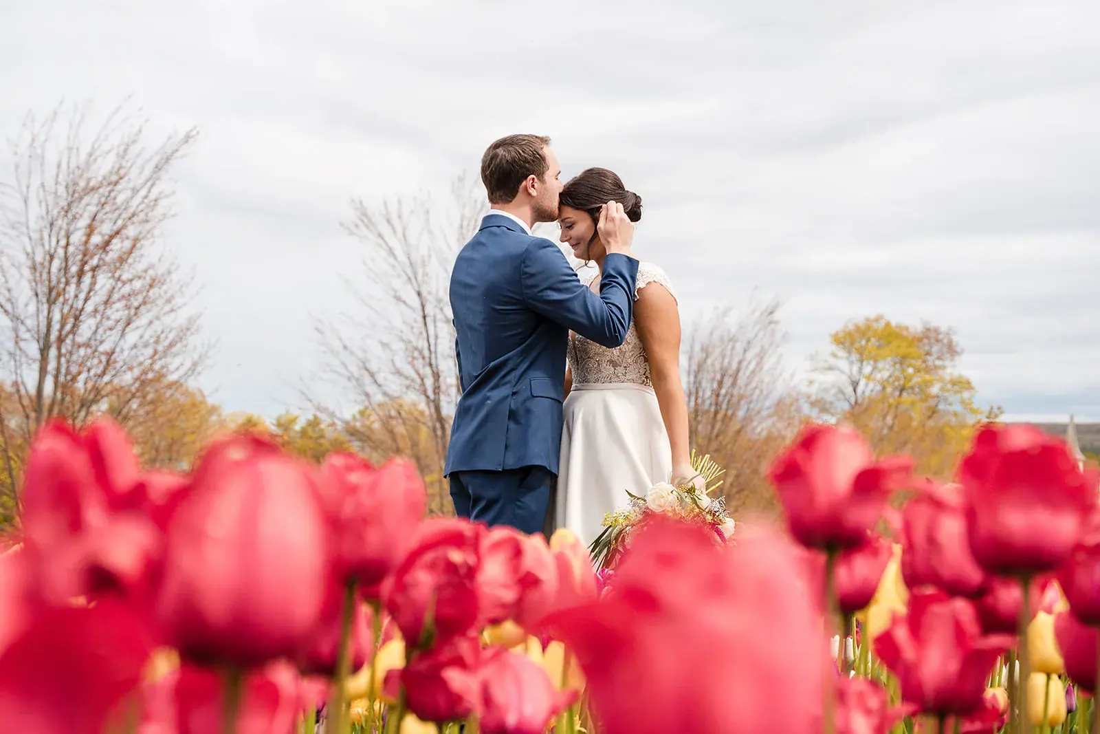 Bride and groom red tulips — Jennifer & Parker's wedding at the Grand Hotel, Mackinac Island