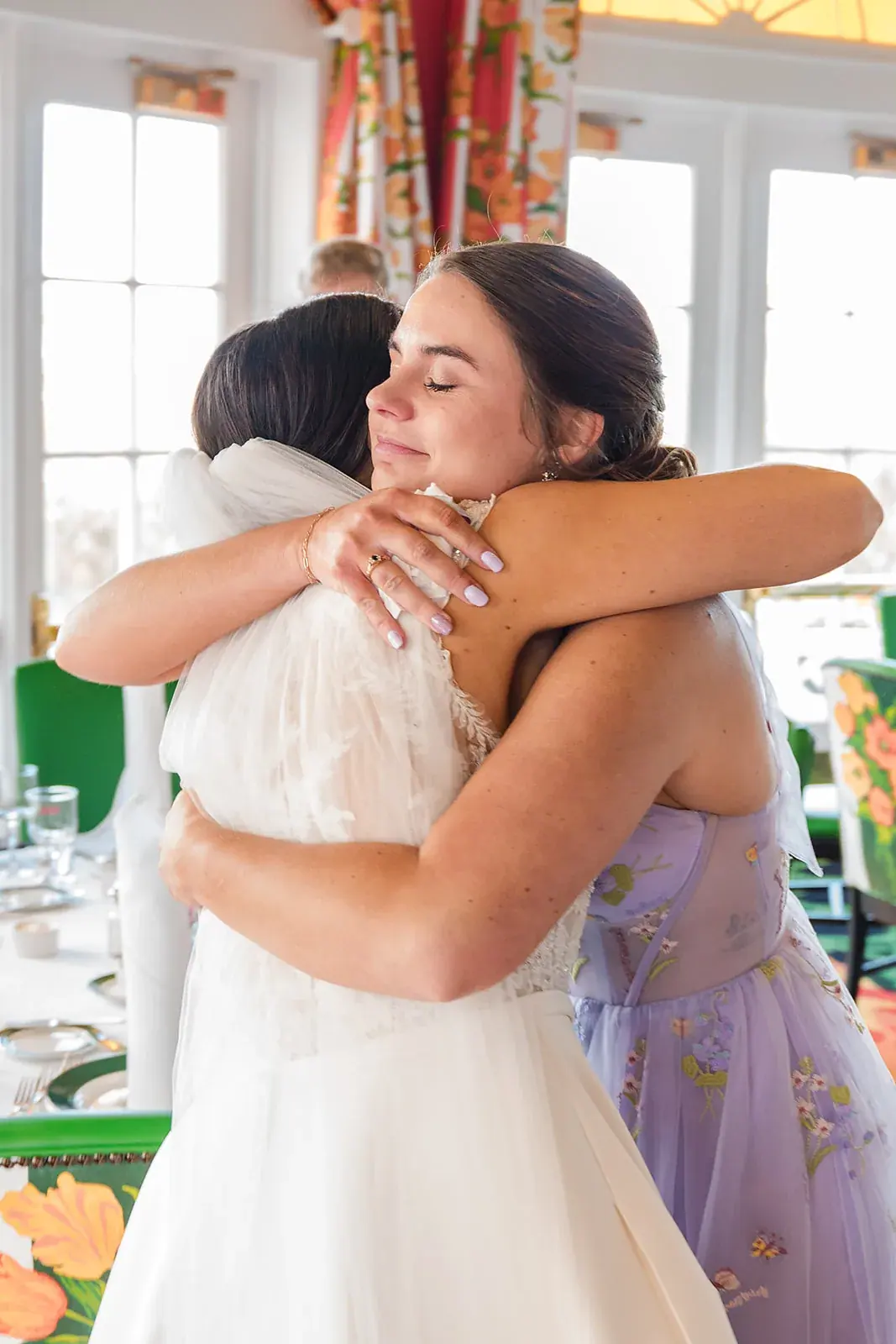 Bride hugging guest — Jennifer & Parker's wedding at the Grand Hotel, Mackinac Island