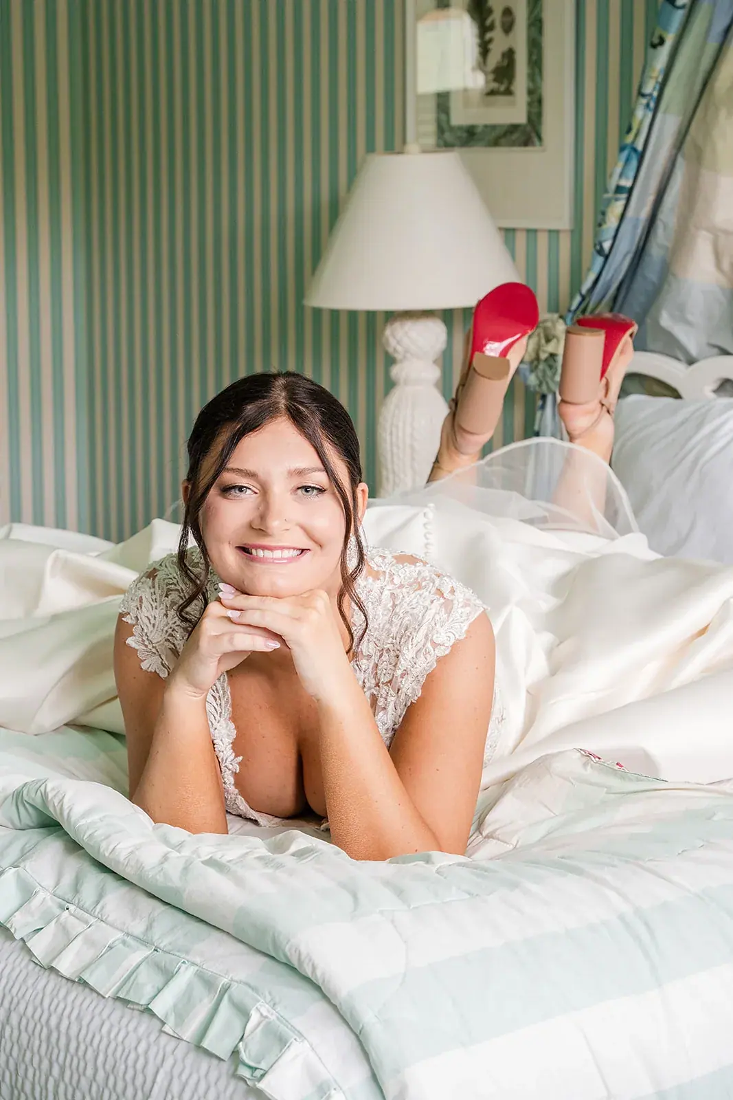 Bride portrait lying on bed — Jennifer & Parker's wedding at the Grand Hotel, Mackinac Island