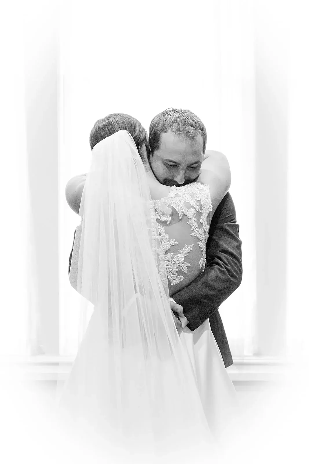 First look embrace in black and white — Jennifer & Parker's wedding at the Grand Hotel, Mackinac Island
