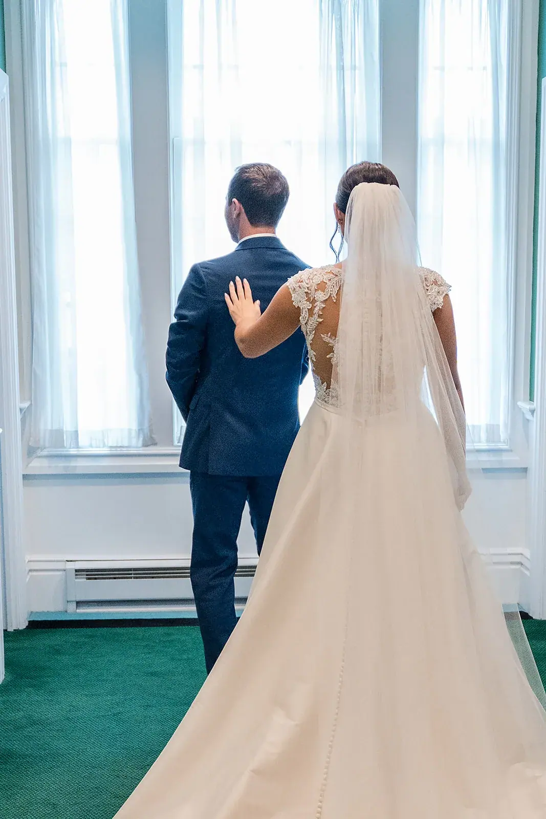 First look groom turning — Jennifer & Parker's wedding at the Grand Hotel, Mackinac Island