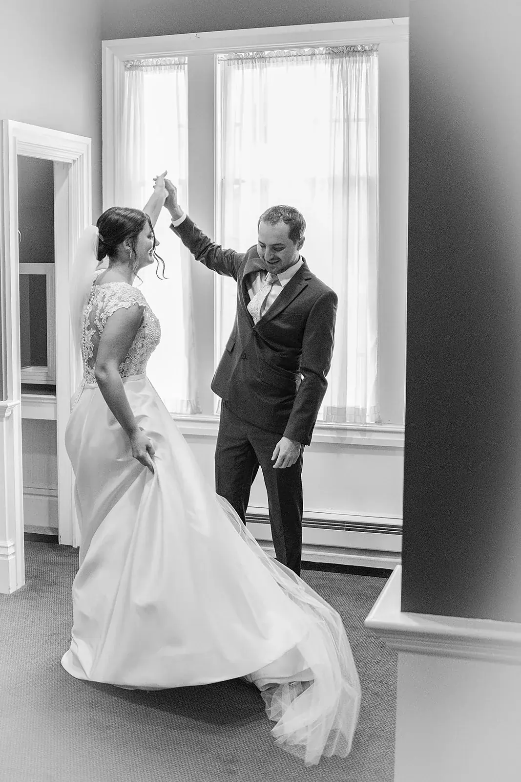 First look twirl in black and white — Jennifer & Parker's wedding at the Grand Hotel, Mackinac Island