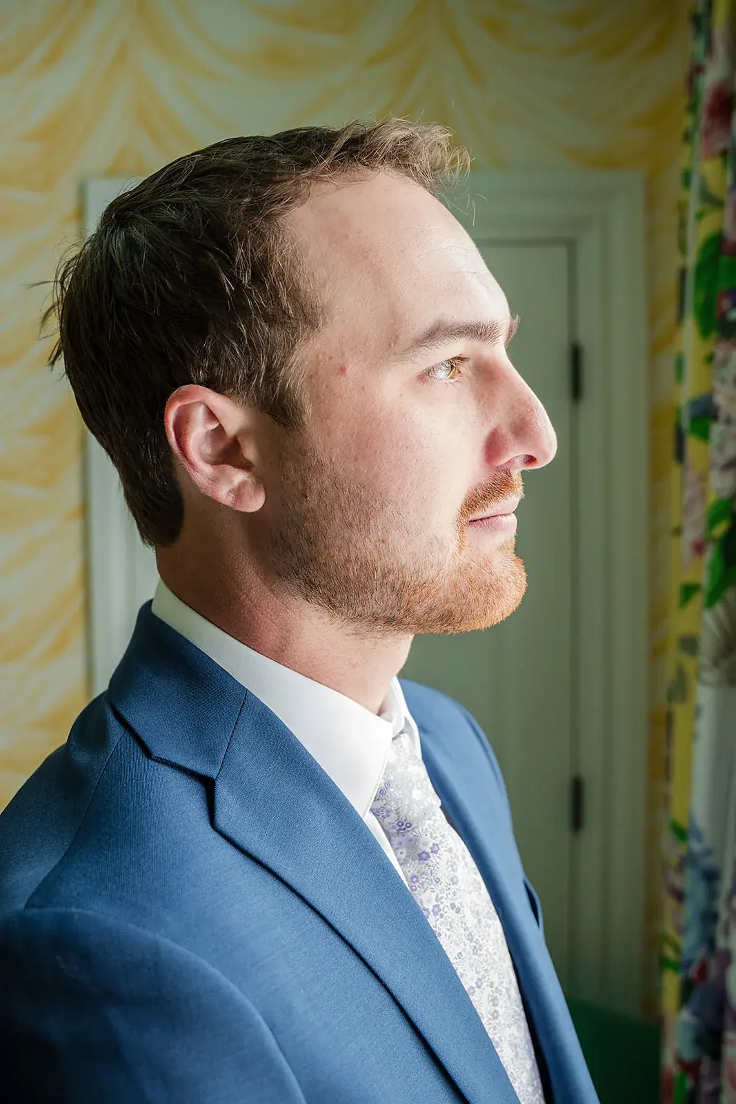 Groom portrait window light — Jennifer & Parker's wedding at the Grand Hotel, Mackinac Island