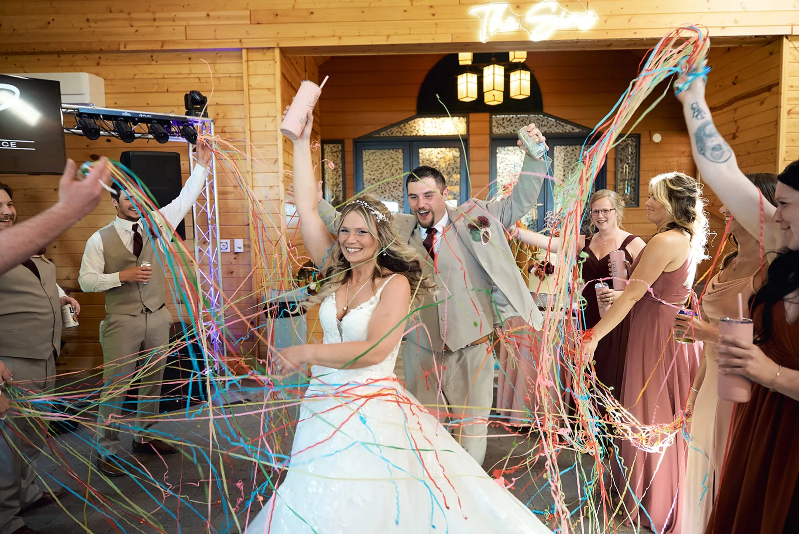 groom solo portrait in vest, cabin door backdrop, getting ready