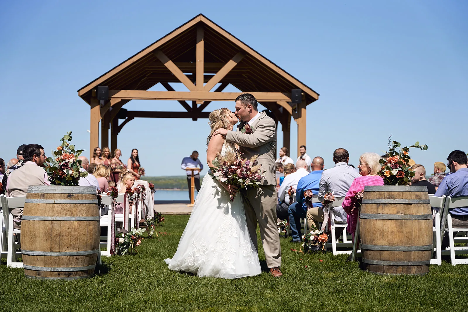 wide shot of guests seated for outdoor ceremony