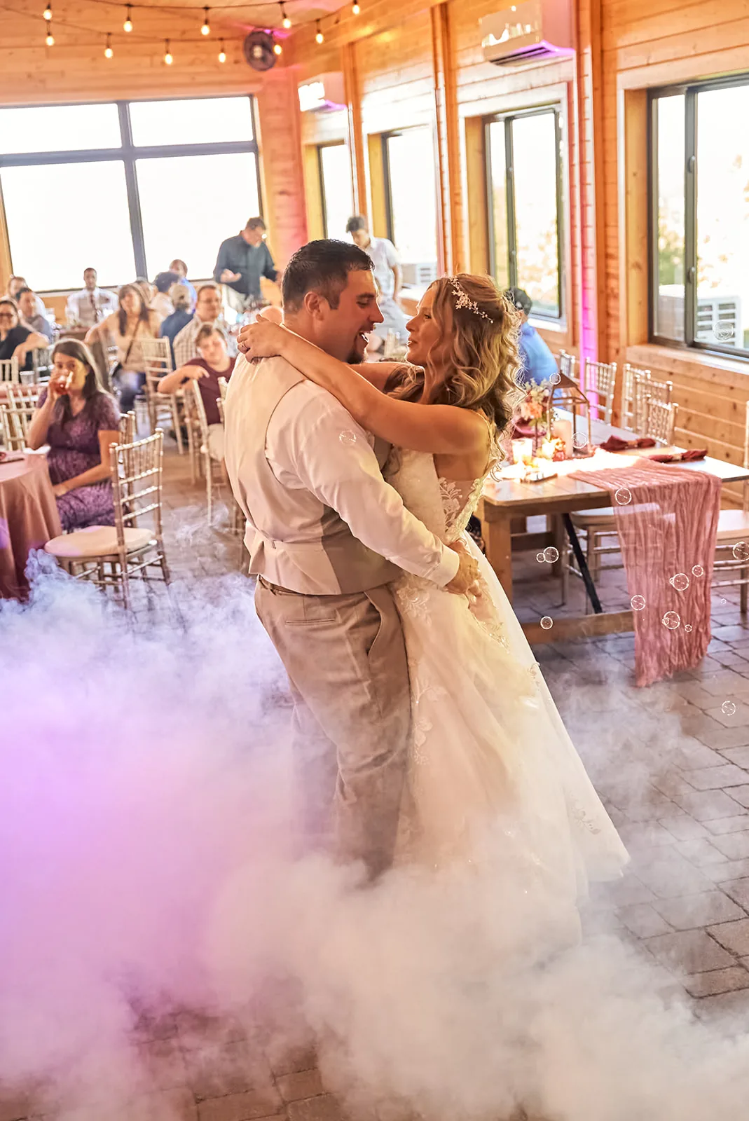 reception candid, bride covered in colorful streamers, celebratory