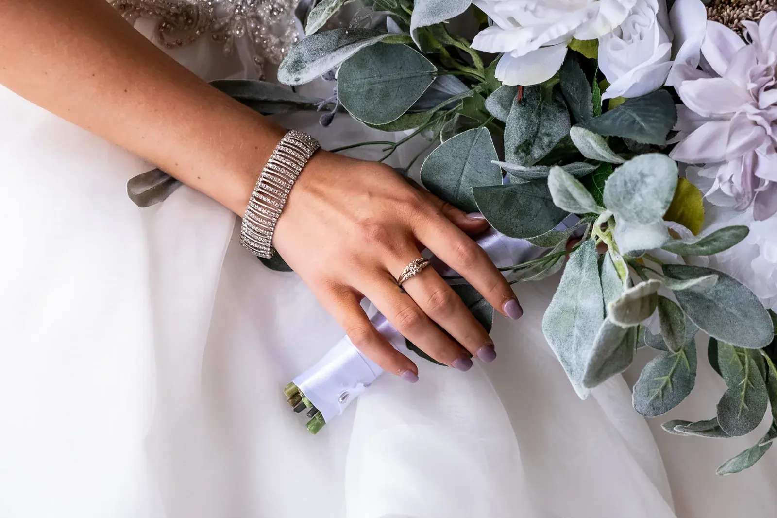 Bride bouquet bracelet detail — Jessica & Joel's wedding at The Rut Hutt, Gaylord