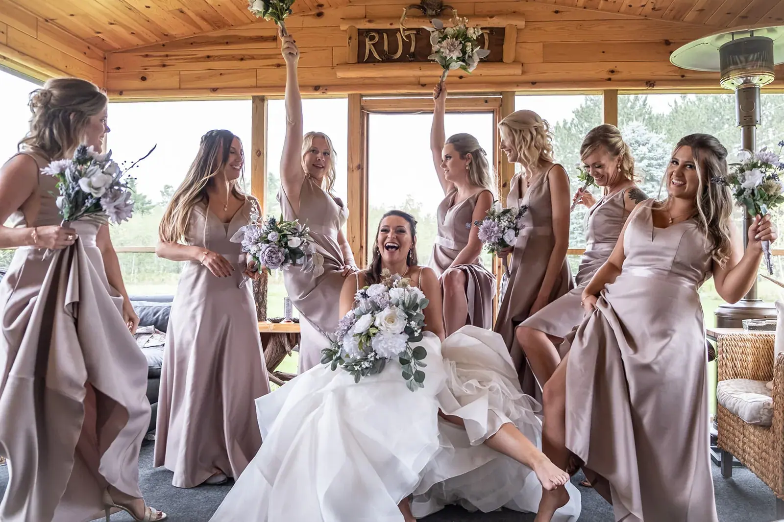 Bride bridesmaids laughing porch — Jessica & Joel's wedding at The Rut Hutt, Gaylord