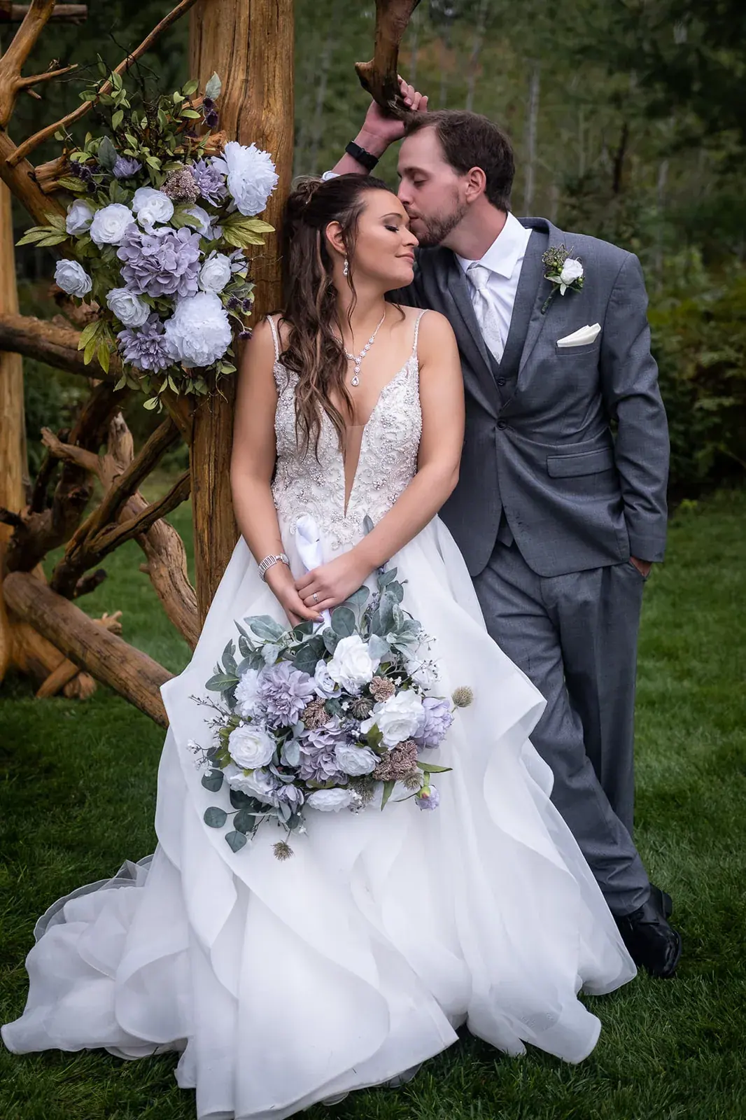 Bride and groom arbor portrait — Jessica & Joel's wedding at The Rut Hutt, Gaylord