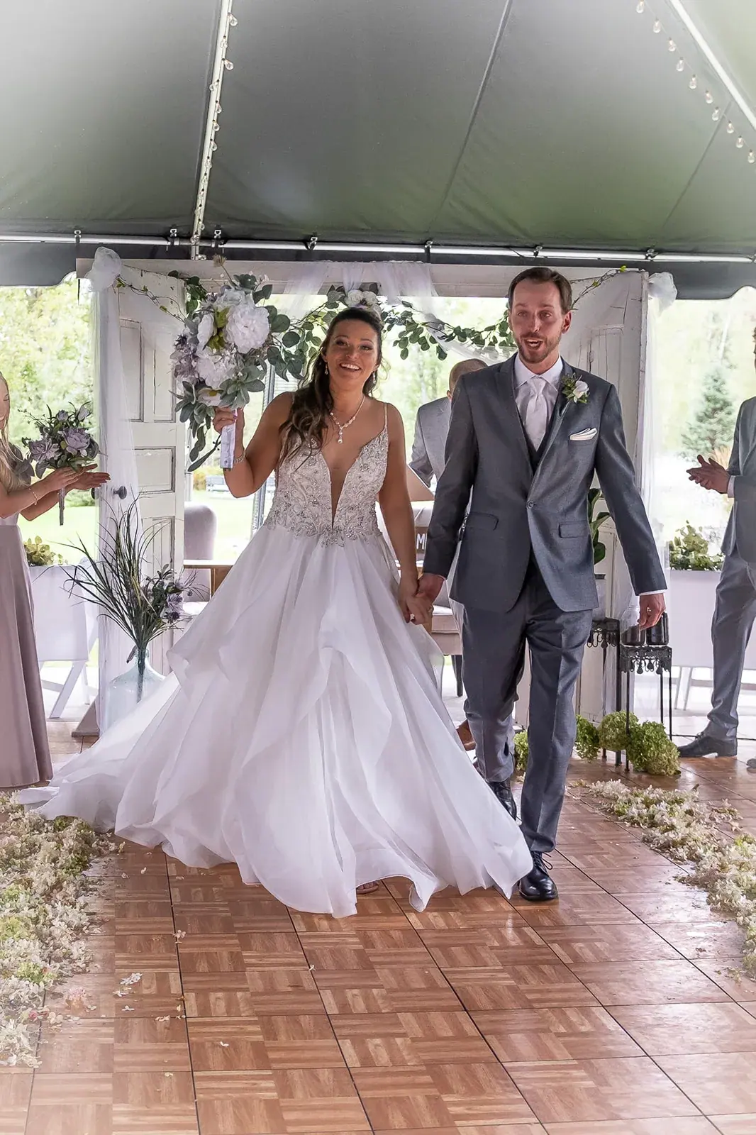 Bride and groom entrance tent — Jessica & Joel's wedding at The Rut Hutt, Gaylord