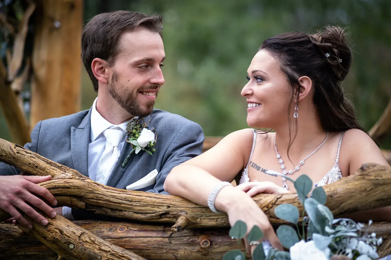 Bride and groom rustic fence — Jessica & Joel's wedding at The Rut Hutt, Gaylord