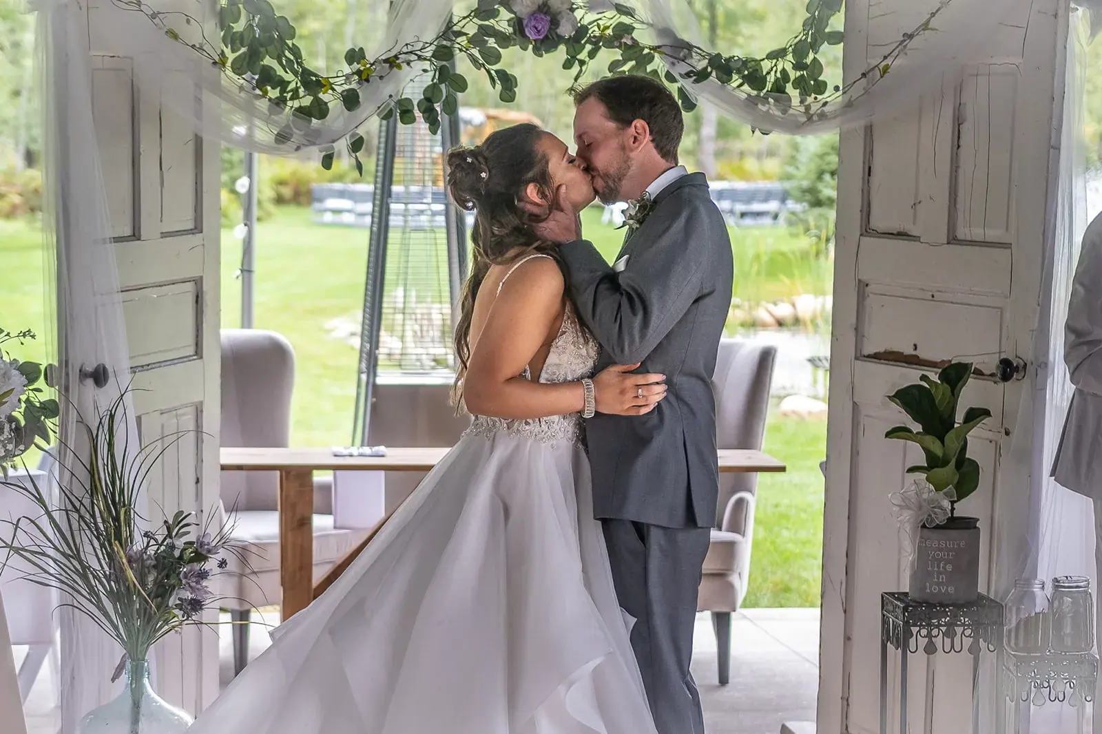 Ceremony kiss barn doors — Jessica & Joel's wedding at The Rut Hutt, Gaylord