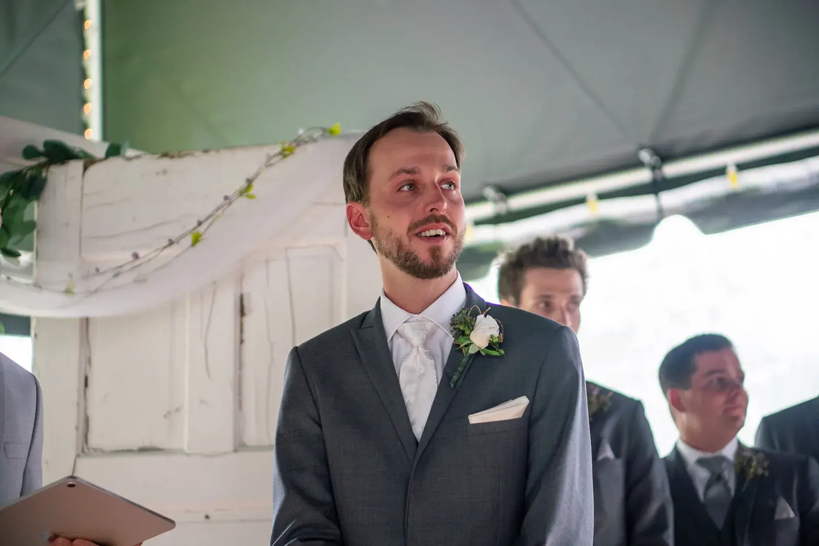 Groom smiling ceremony — Jessica & Joel's wedding at The Rut Hutt, Gaylord