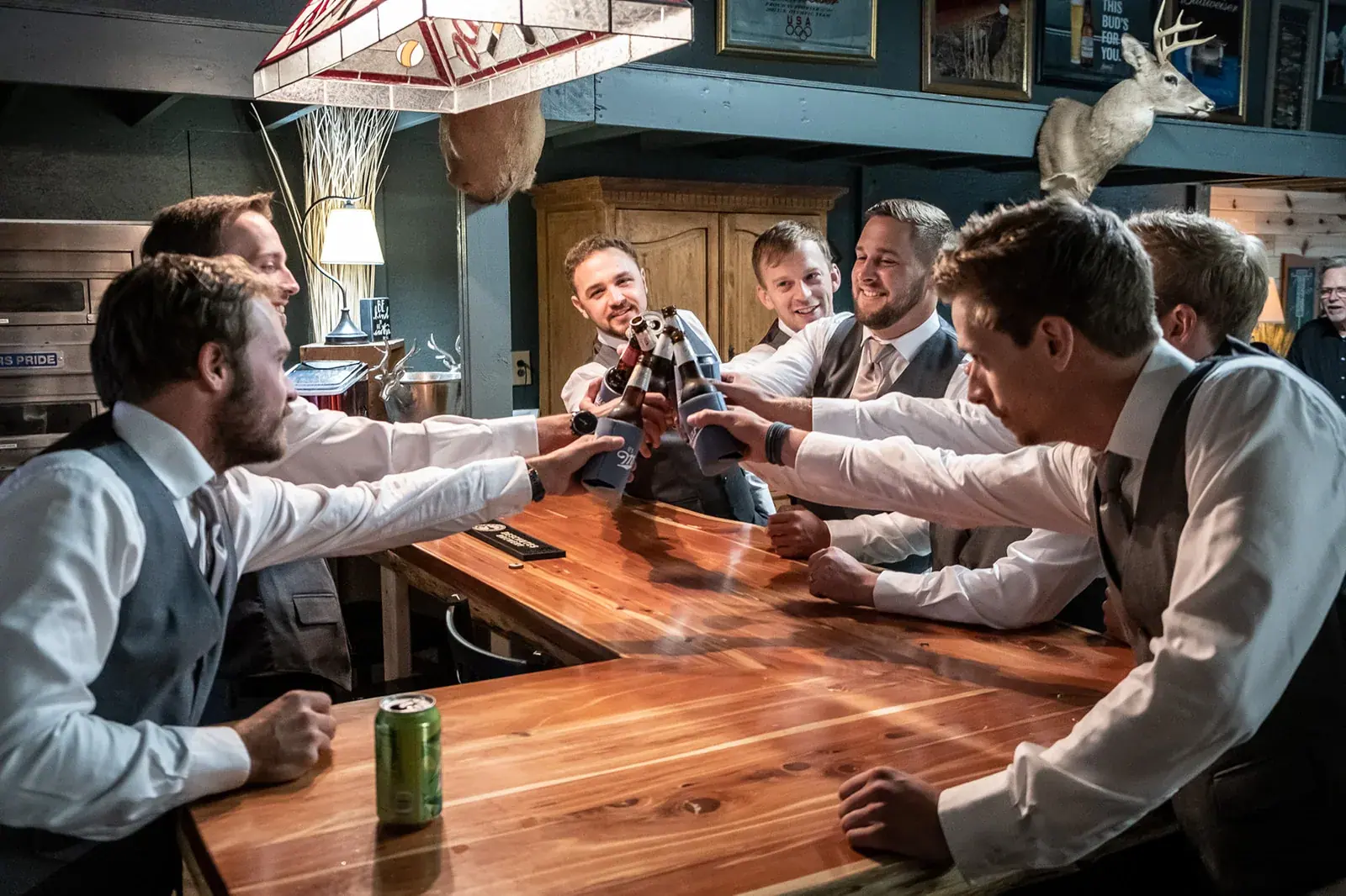 Groomsmen bar candid — Jessica & Joel's wedding at The Rut Hutt, Gaylord