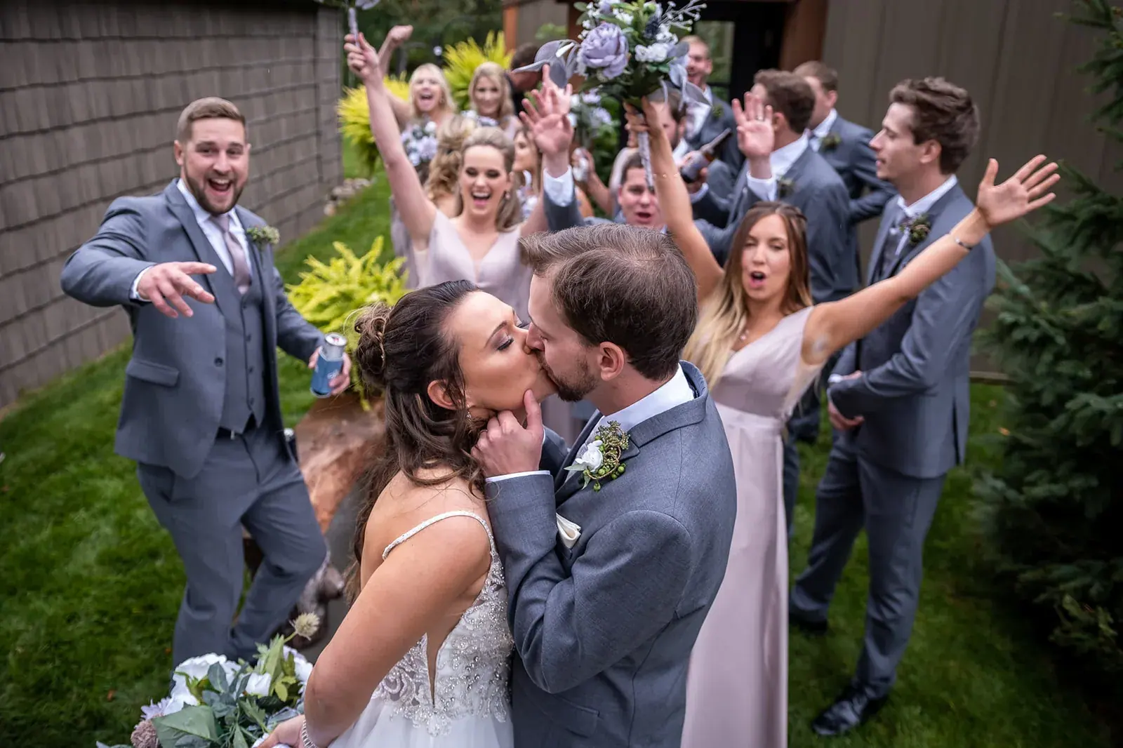 Wedding party celebrating kiss — Jessica & Joel's wedding at The Rut Hutt, Gaylord