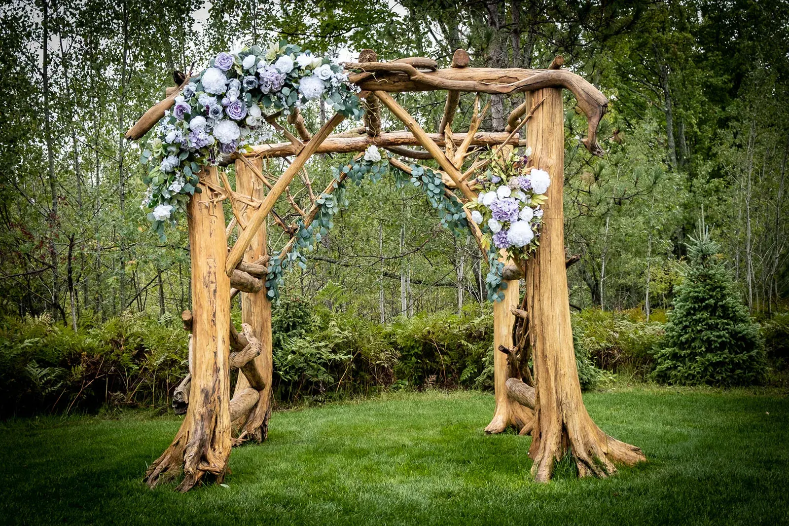Rustic floral arbor — Jessica & Joel's wedding at The Rut Hutt, Gaylord