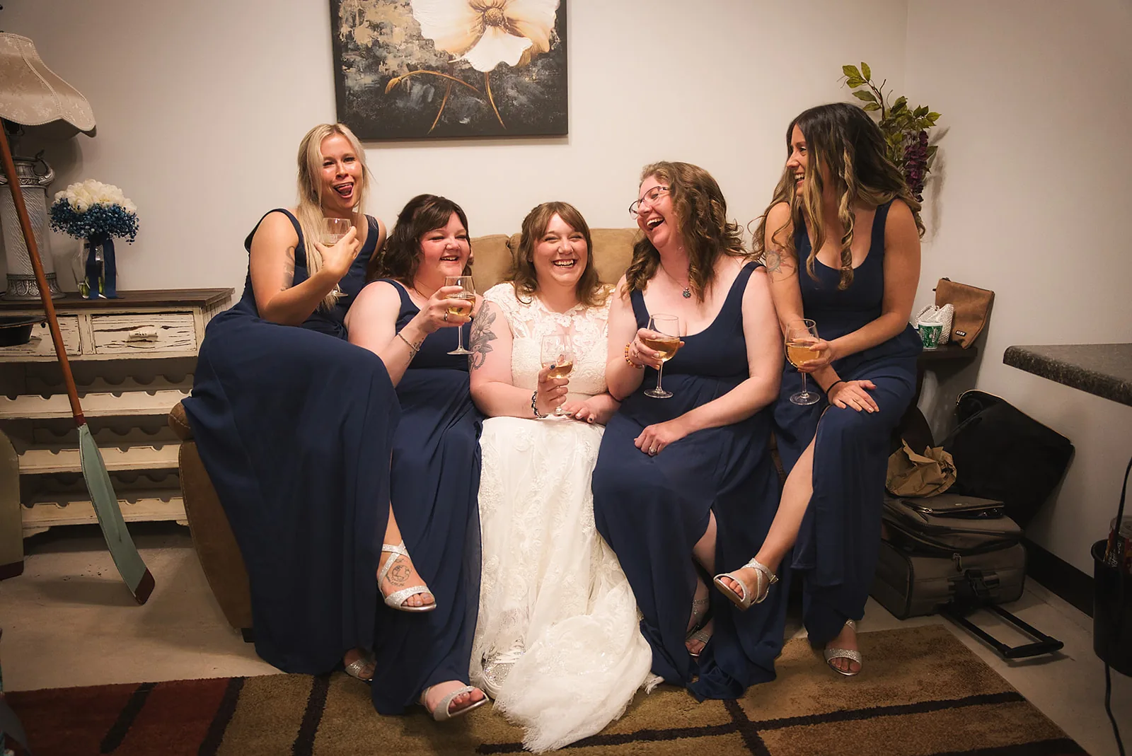 bridesmaids candid group laughing together, getting ready