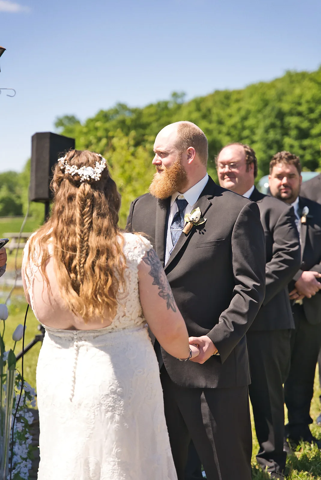 groom solo portrait waiting at aisle, close-up