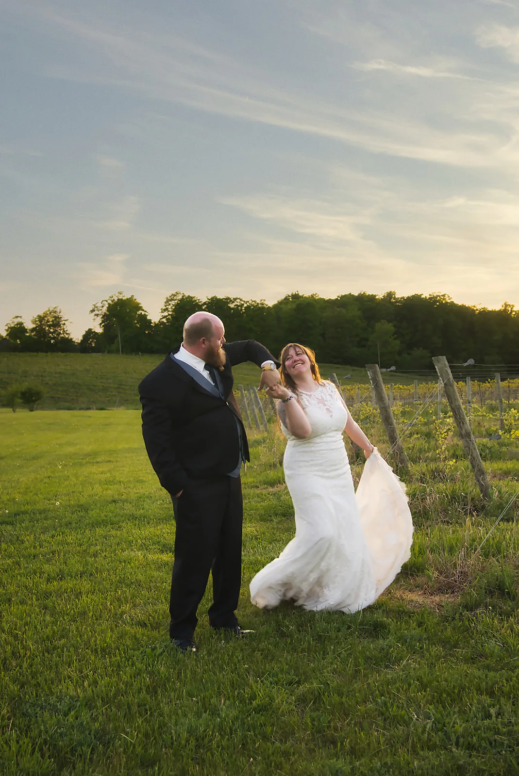 bride and groom portrait at winery bar counter, string lights