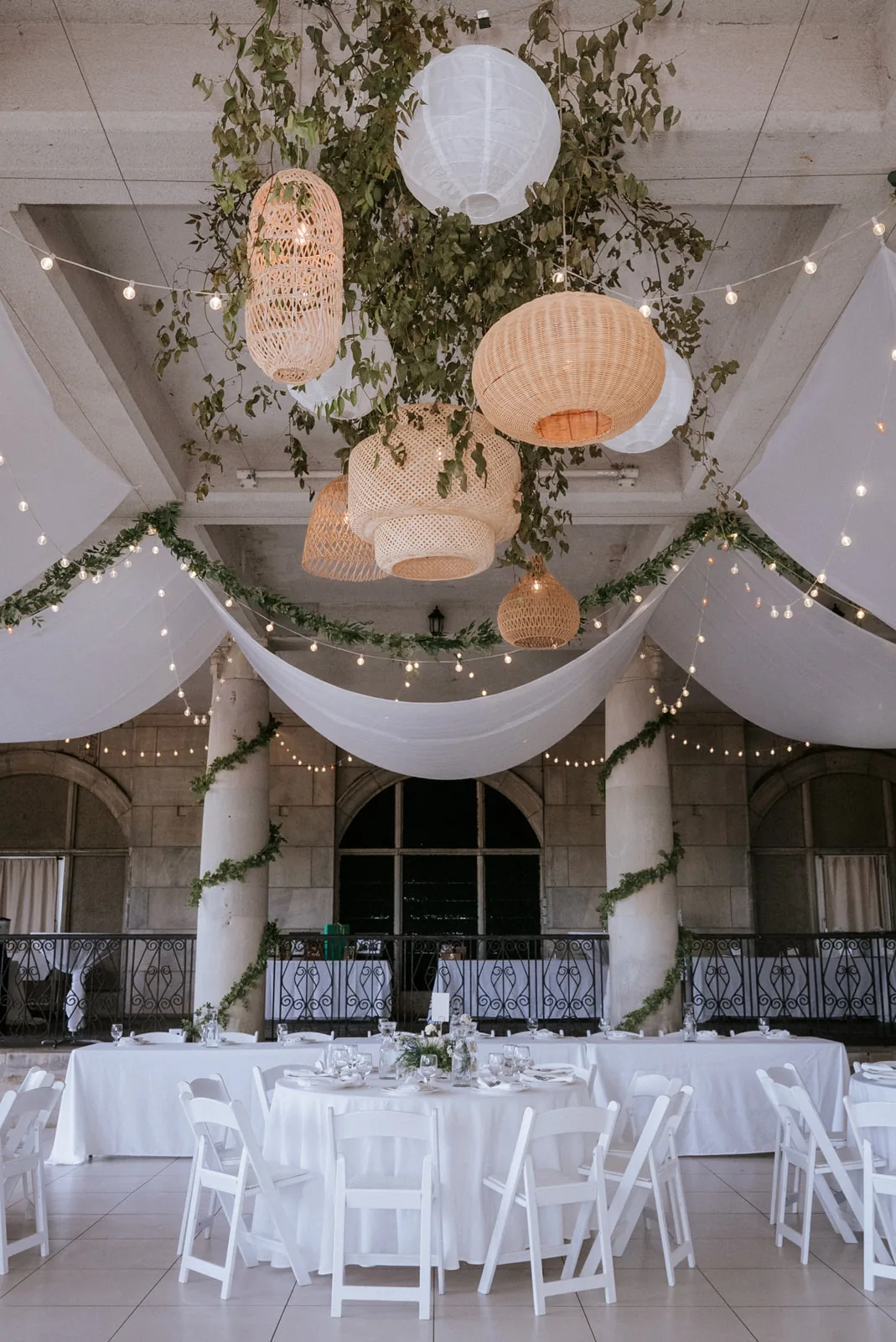 reception room ceiling decor detail, hanging lanterns and greenery