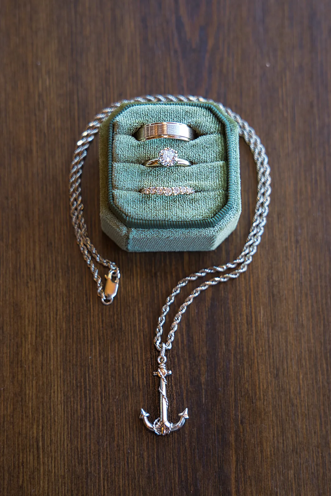 detail flatlay of pearl bracelet and "Happily Ever After" pouch