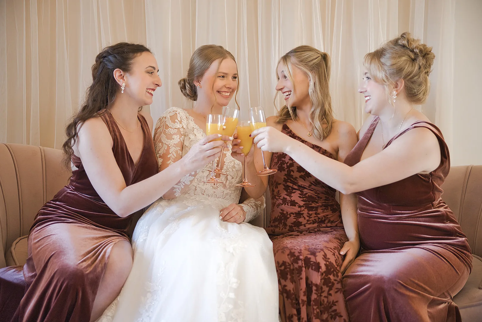 bridesmaids group portrait holding bouquets on stone staircase