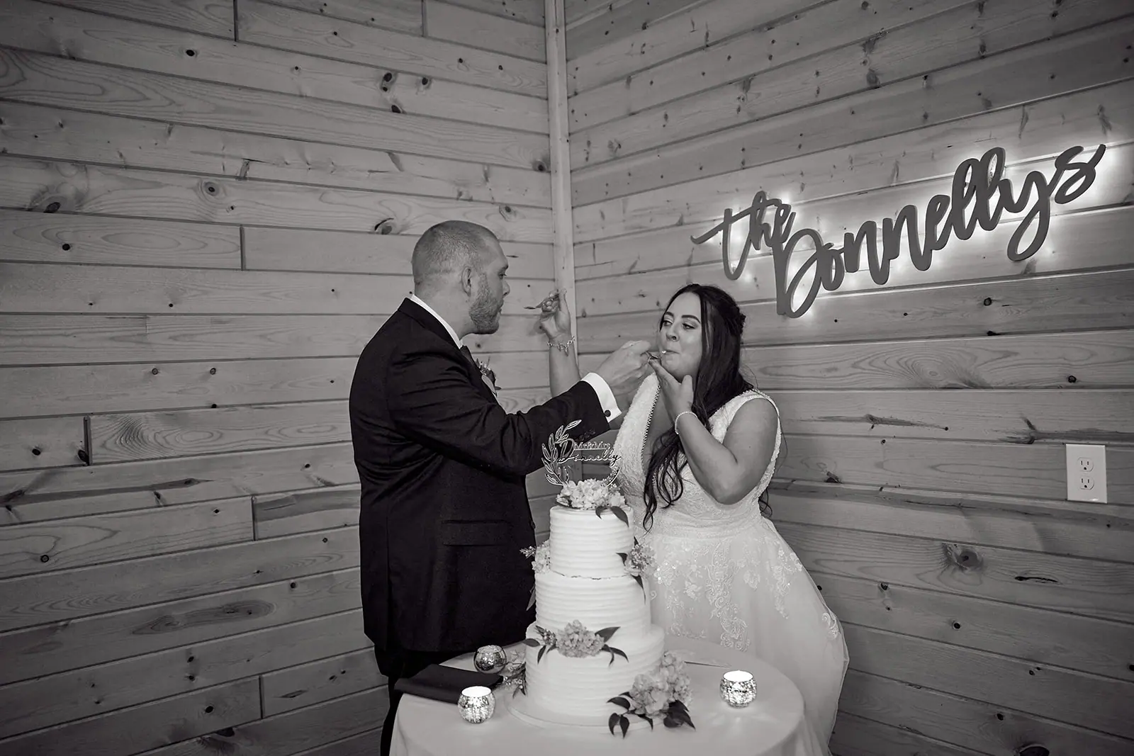 Black white couple cutting cake donnellys — Taylor & Mark's wedding at The Manor at Fire Tower Hill, Lewiston, MI