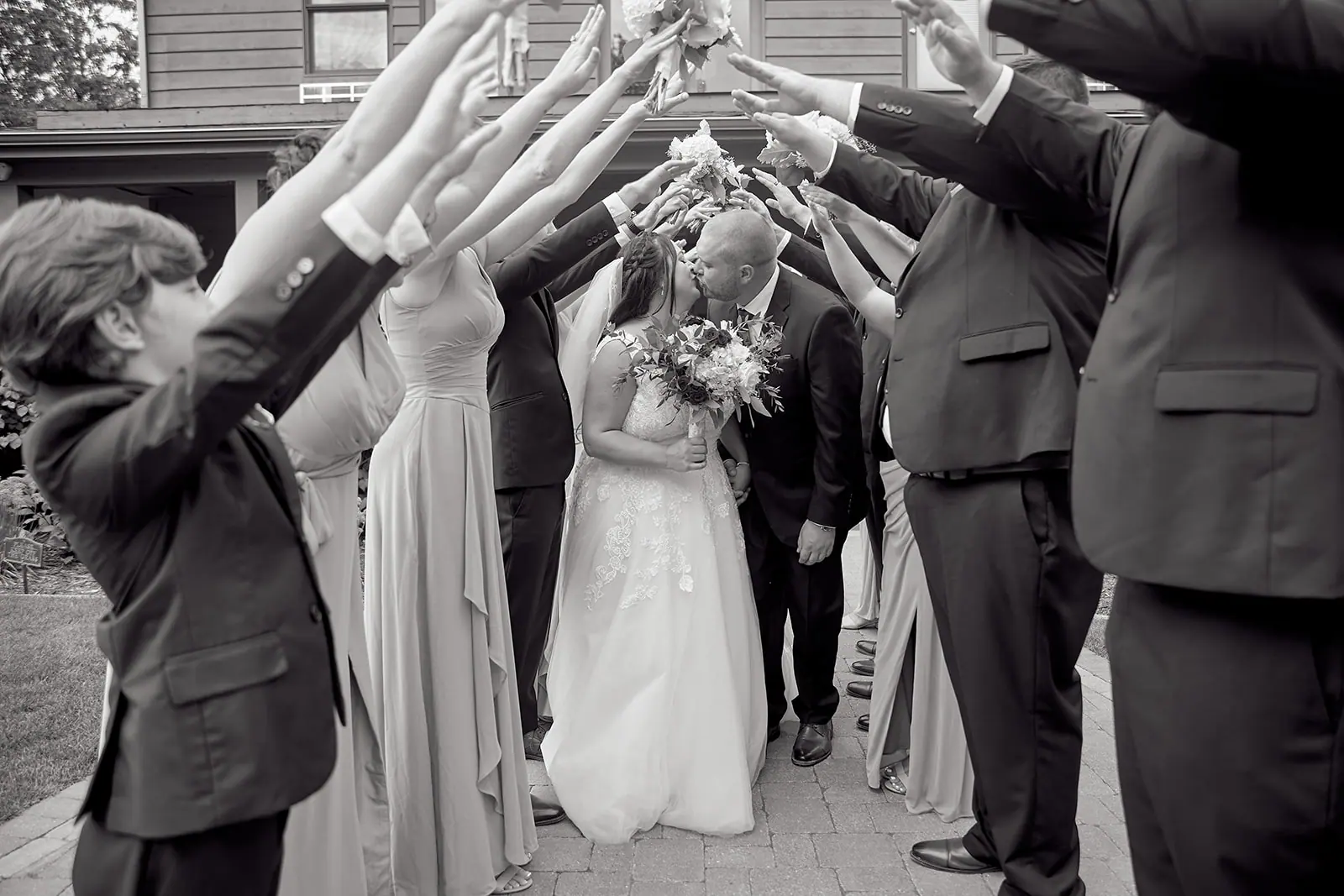 Black white wedding party raising arms — Taylor & Mark's wedding at The Manor at Fire Tower Hill, Lewiston, MI
