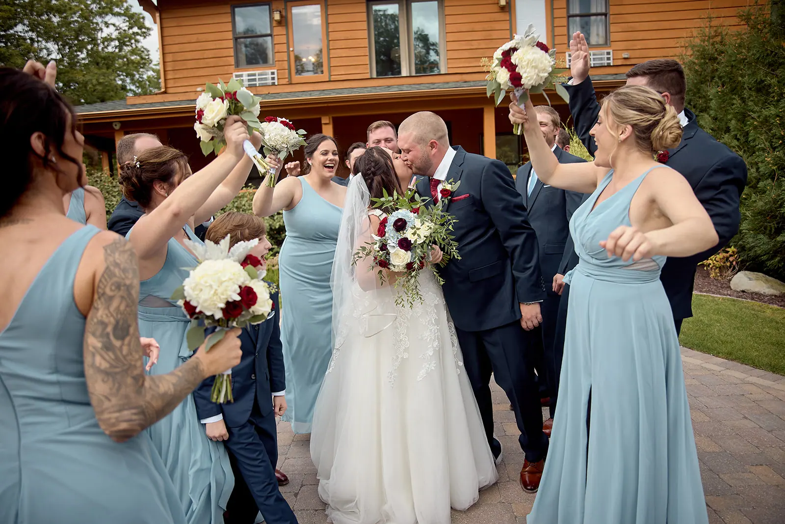 Bride bridesmaids blue raising bouquets groomsmen — Taylor & Mark's wedding at The Manor at Fire Tower Hill, Lewiston, MI