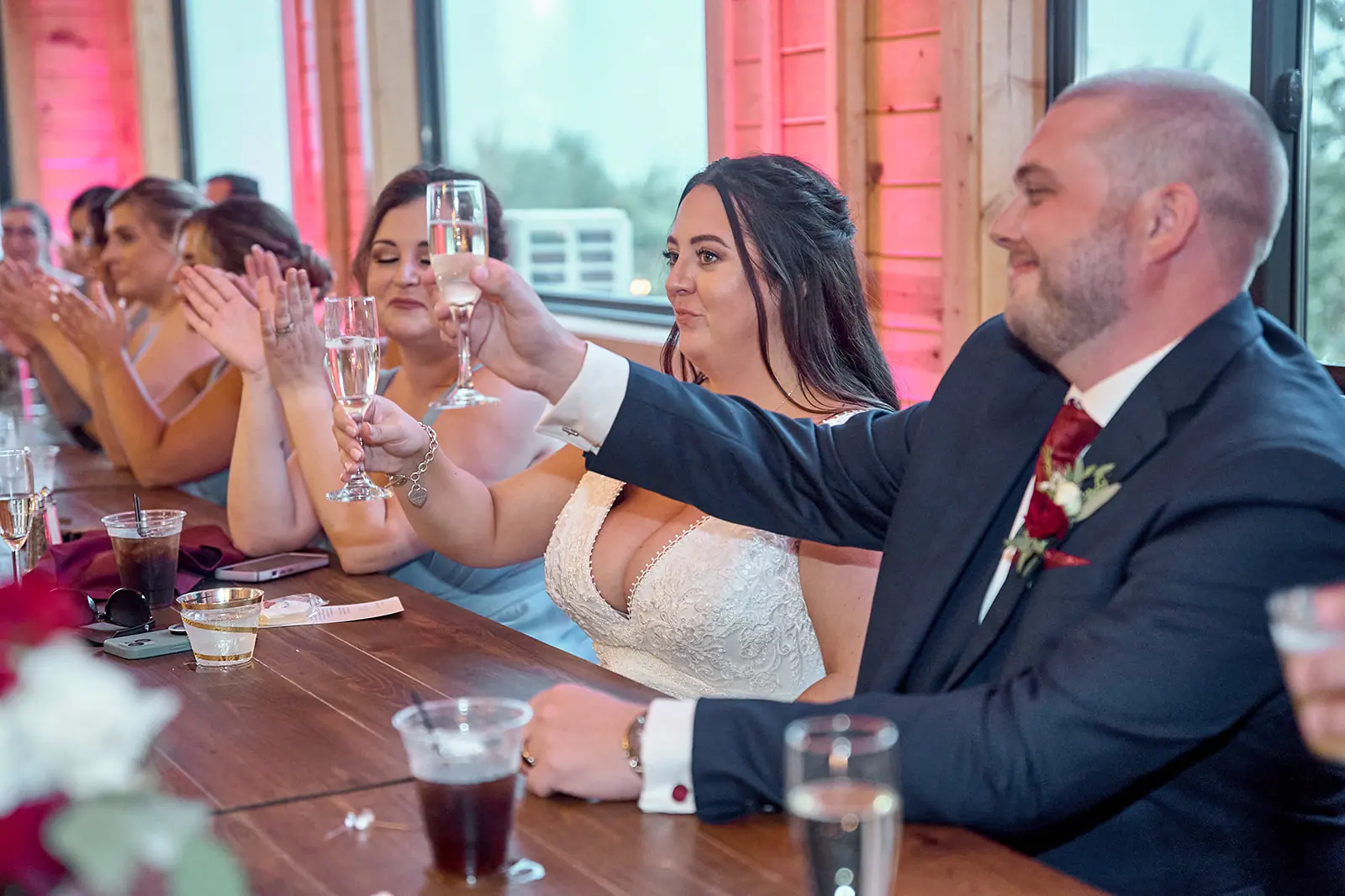 Bride groom raising glasses guests table — Taylor & Mark's wedding at The Manor at Fire Tower Hill, Lewiston, MI
