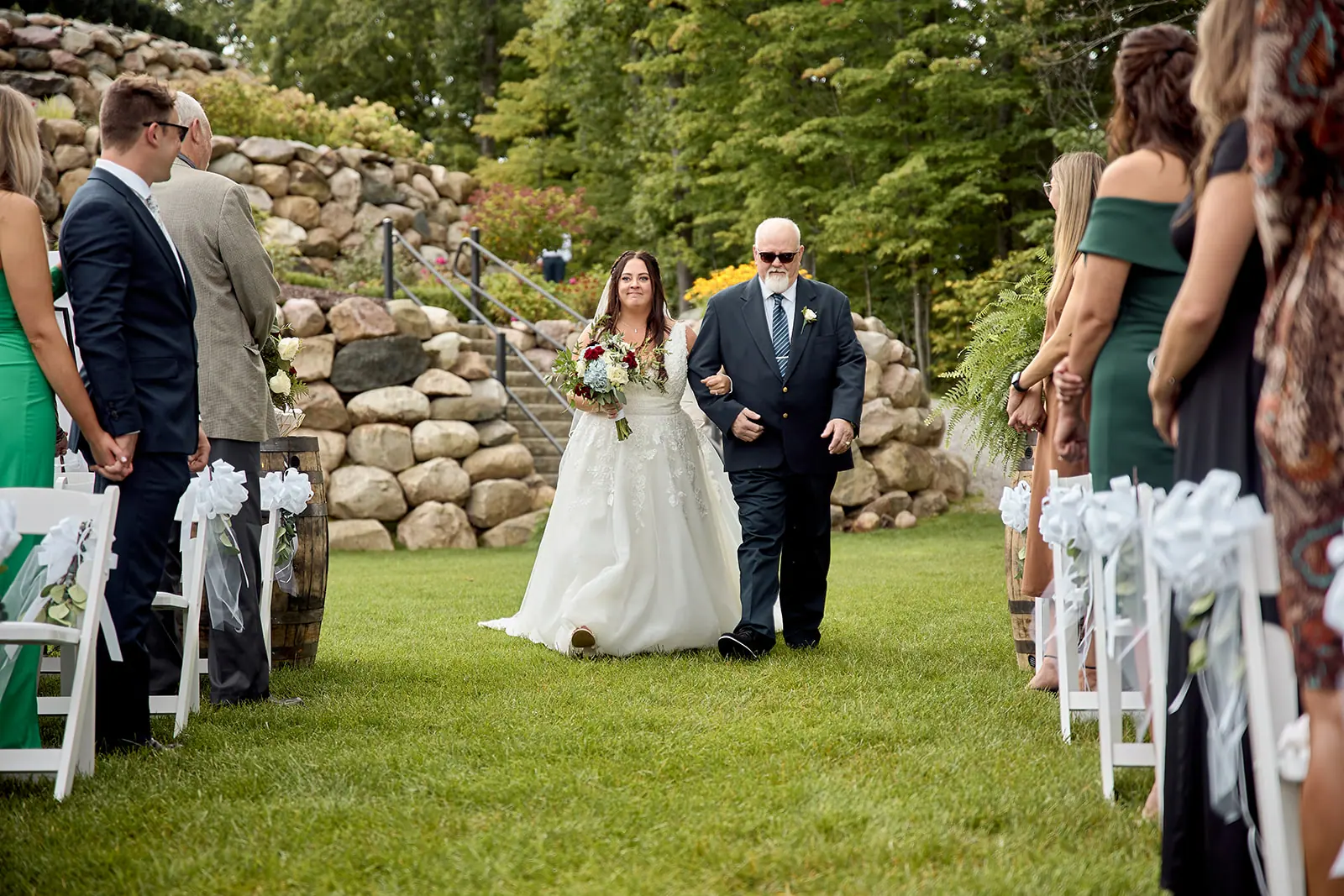Bride walking aisle father s arm — Taylor & Mark's wedding at The Manor at Fire Tower Hill, Lewiston, MI