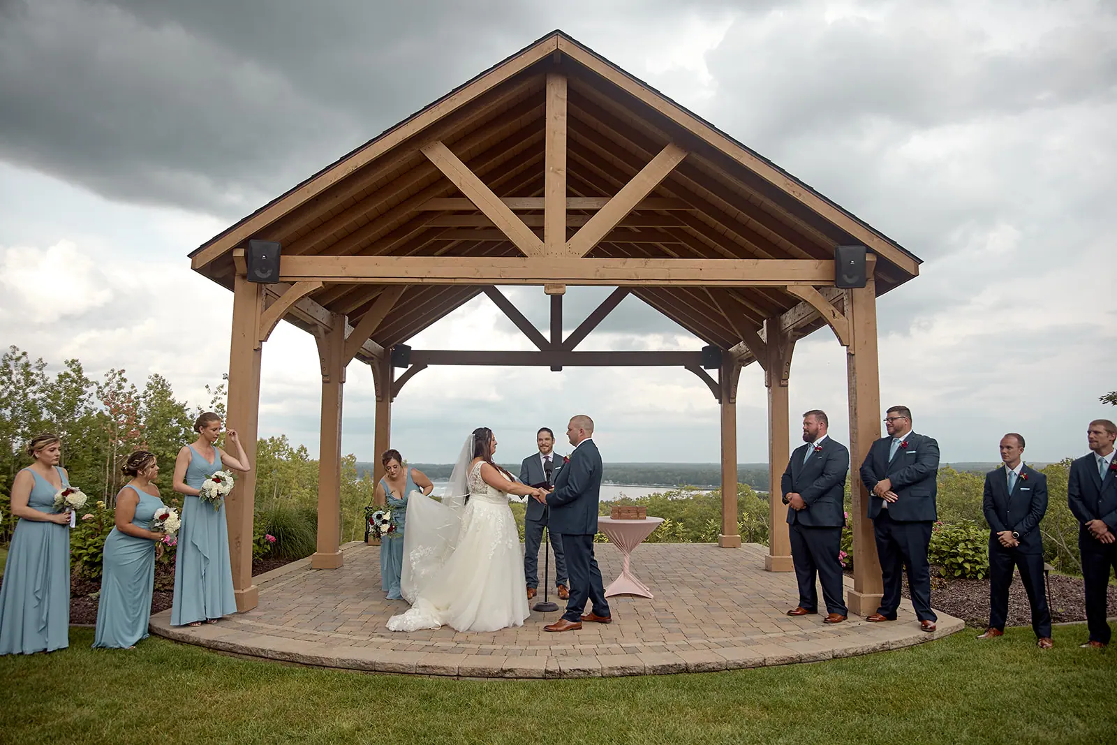 Couple pavilion altar bridal party around — Taylor & Mark's wedding at The Manor at Fire Tower Hill, Lewiston, MI