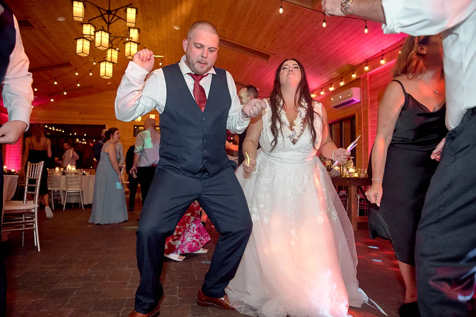 Groom bride dancing groomsman s arms — Taylor & Mark's wedding at The Manor at Fire Tower Hill, Lewiston, MI